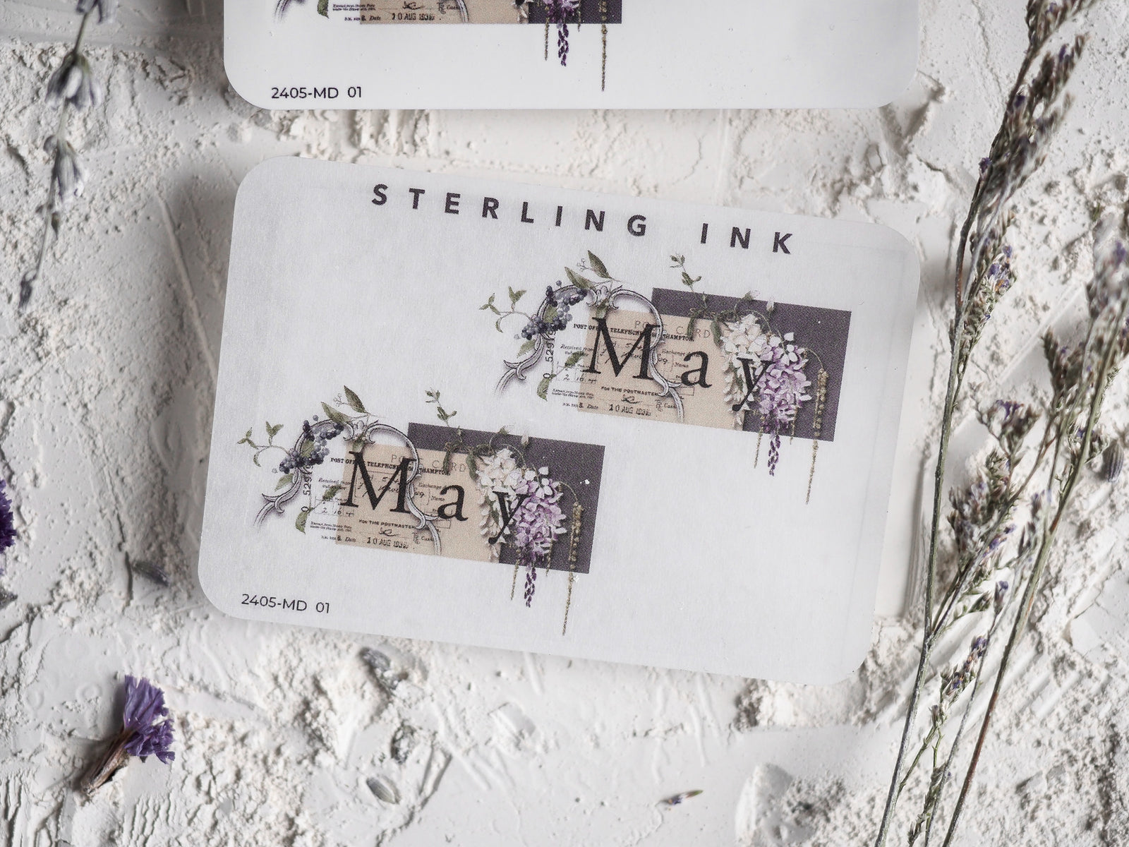Elegant May month sticker featuring a sophisticated design of watercolor purple florals and delicate botanical elements surrounding the month's name.