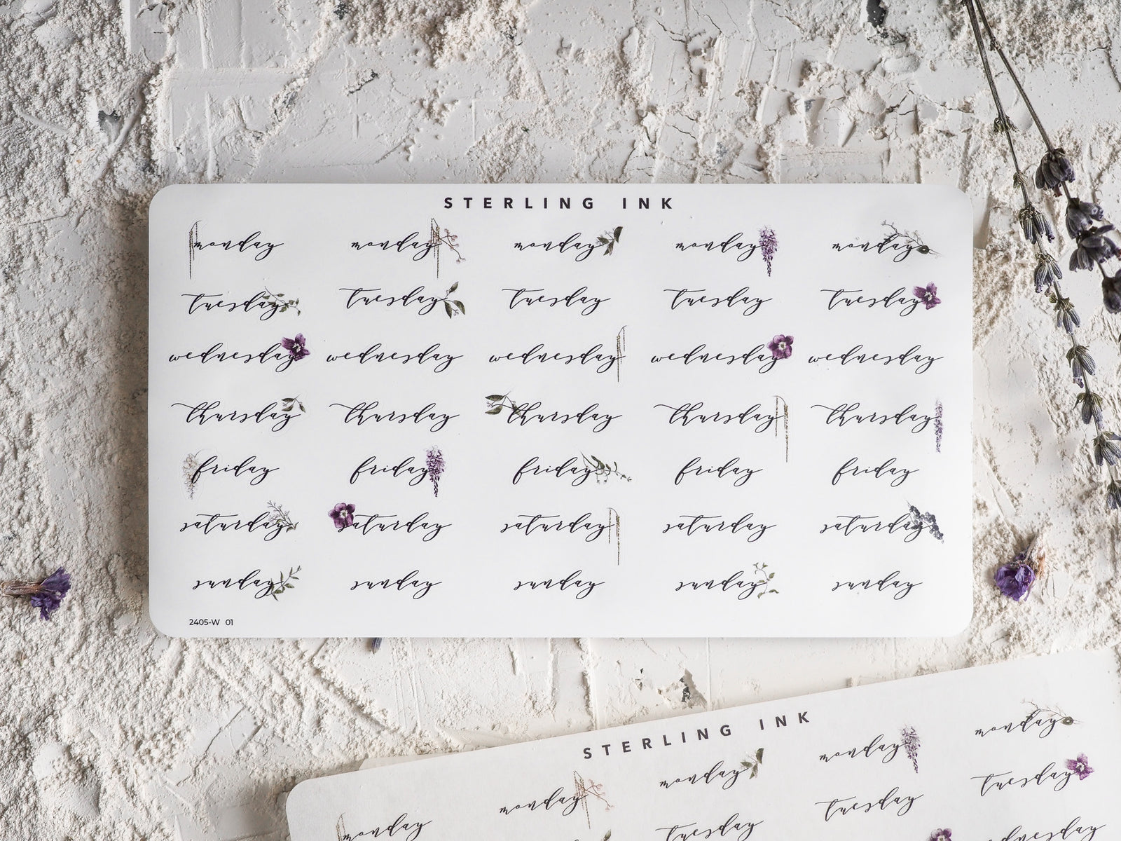 Decorative "STEARLING INK" calendar stickers marking the days of the week for May 2024, featuring script lettering and elegant daily labels.