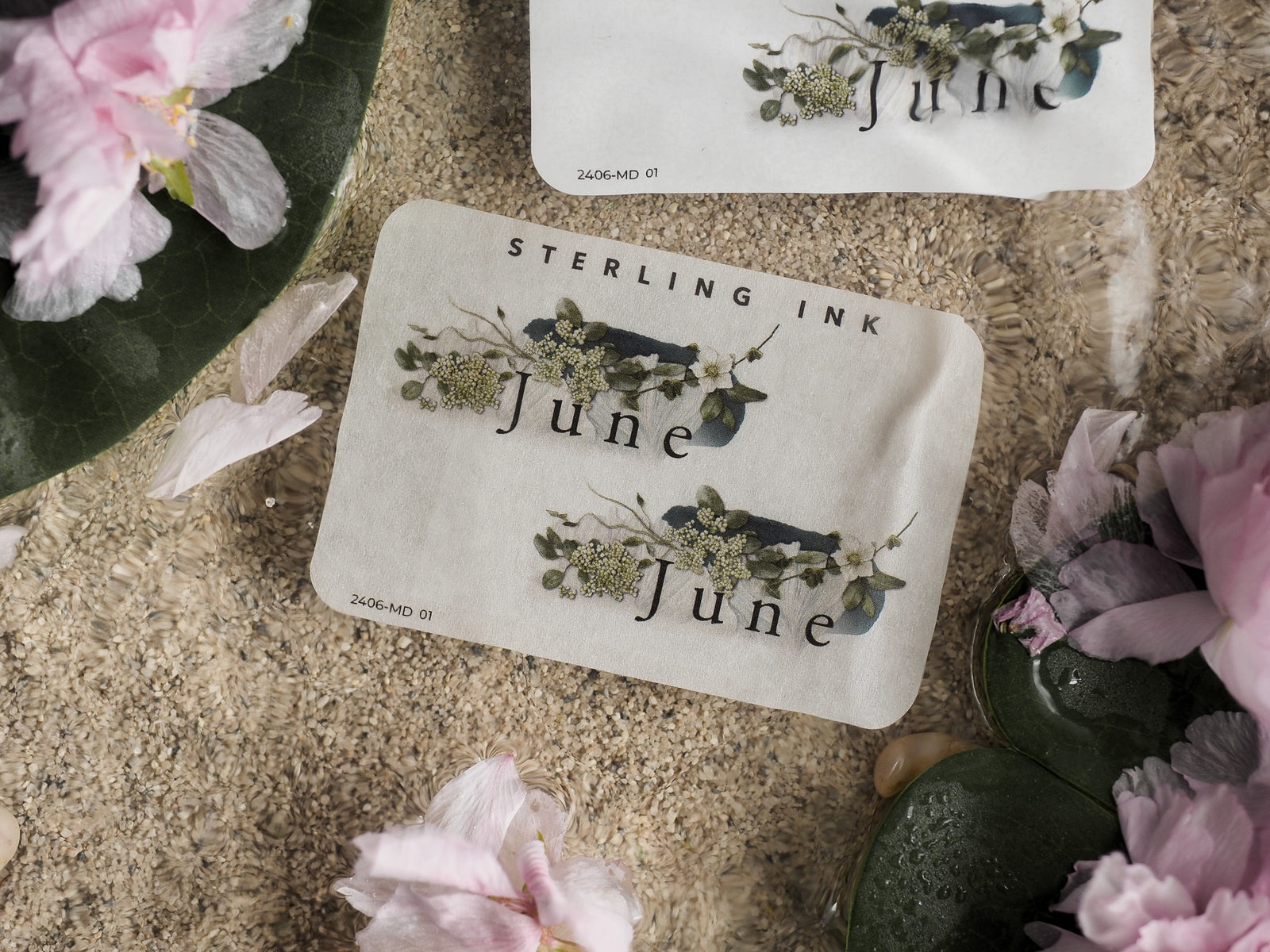 Elegant June month sticker sheet featuring detailed botanical illustrations of green foliage and delicate blue wildflowers for journaling and scrapbooking.