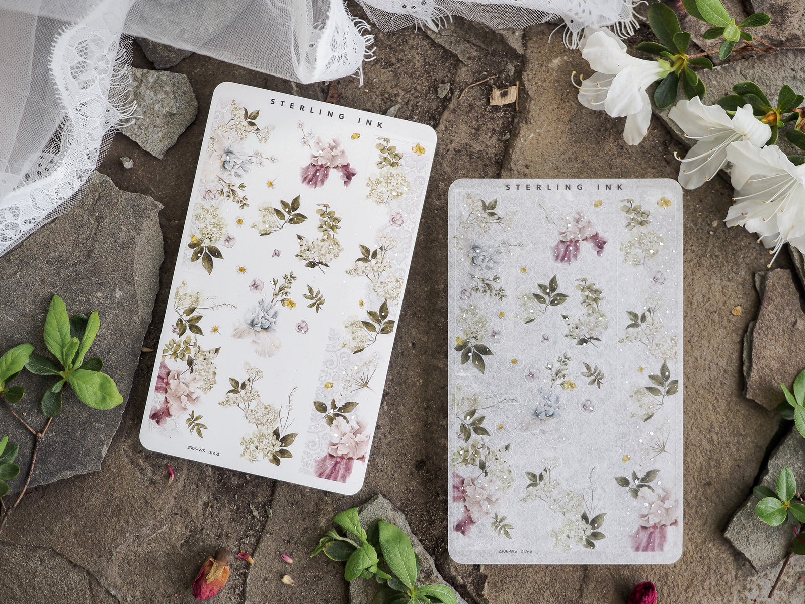 Delicate botanical washi stickers featuring scattered wildflowers and foliage in soft pink, sage, and cream tones.
