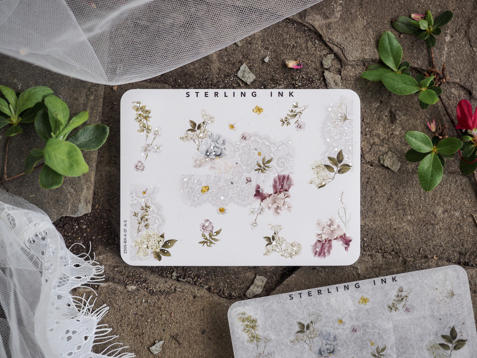 Sheet of delicate, pastel floral corner stickers featuring vintage blossoms and leaves with shimmering silver foil accents.