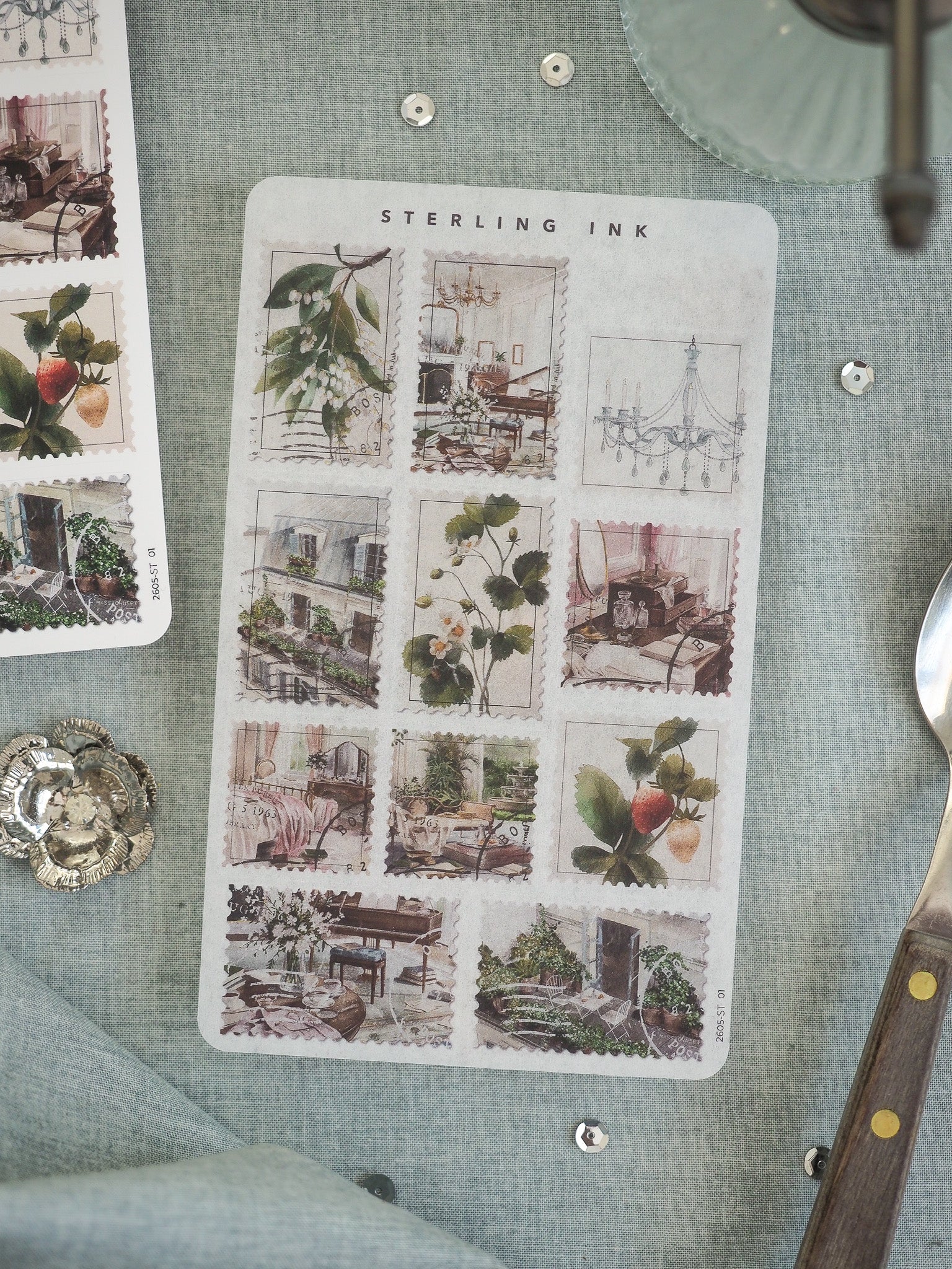 Vintage "STERLING INK" sticker sheet showcasing a grid of charming watercolor illustrations of florals, botanical elements, and rustic home decor.