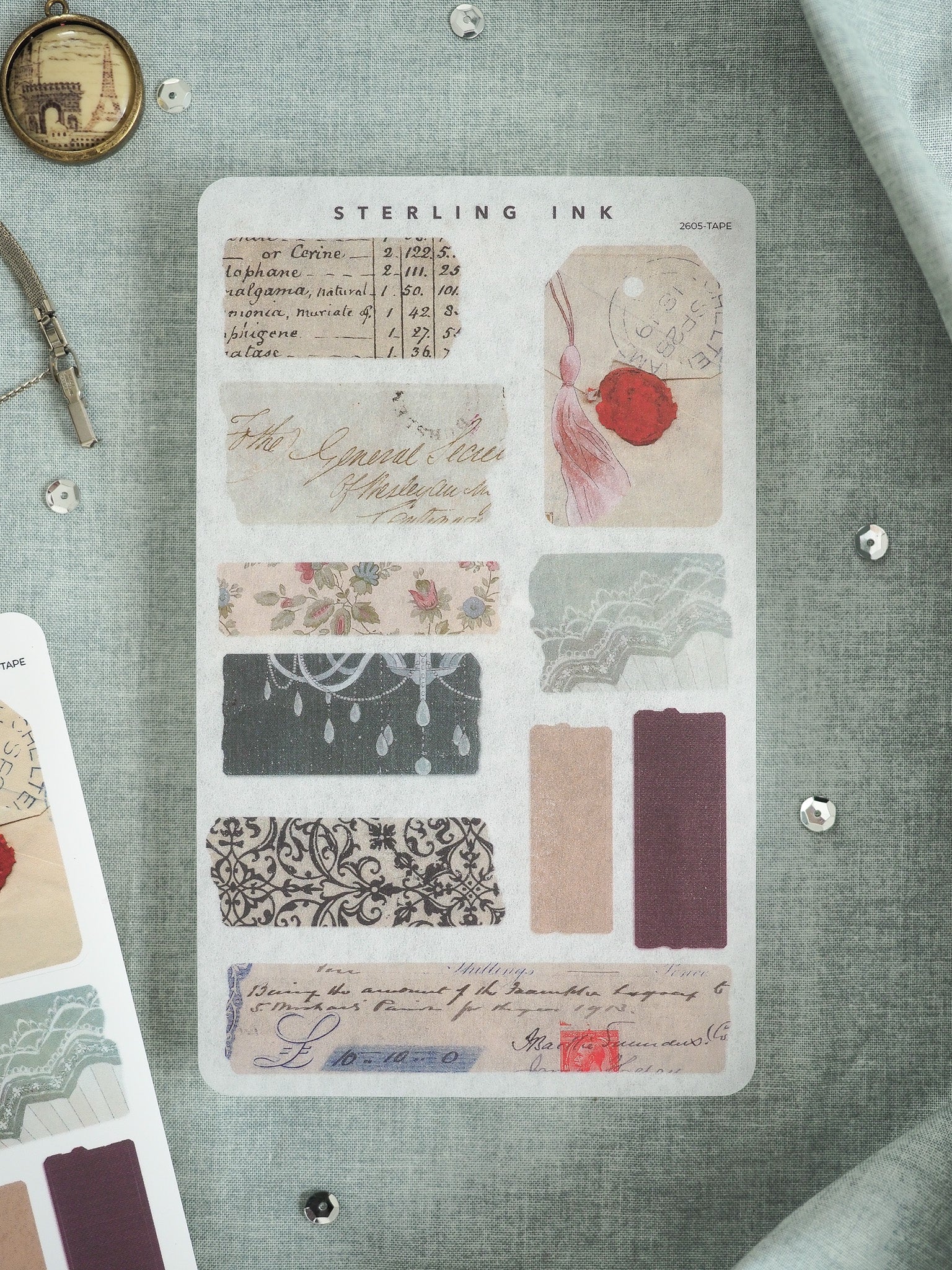 Vintage "Sterling Ink" craft ephemera featuring layered swatches of ornate Victorian patterns, delicate lace, florals, and muted solid-colored decorative paper strips.