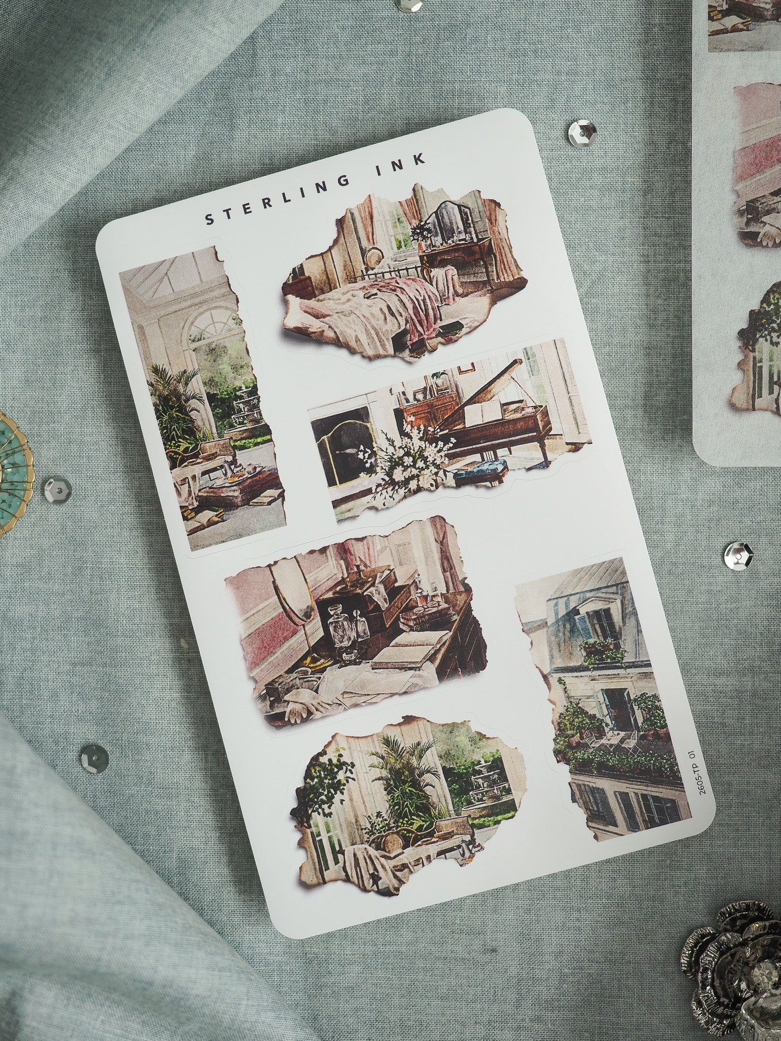 "STERLING INK" sticker sheet featuring vintage, distressed watercolor illustrations of rustic, cozy, and architectural indoor scenes perfect for scrapbooking.