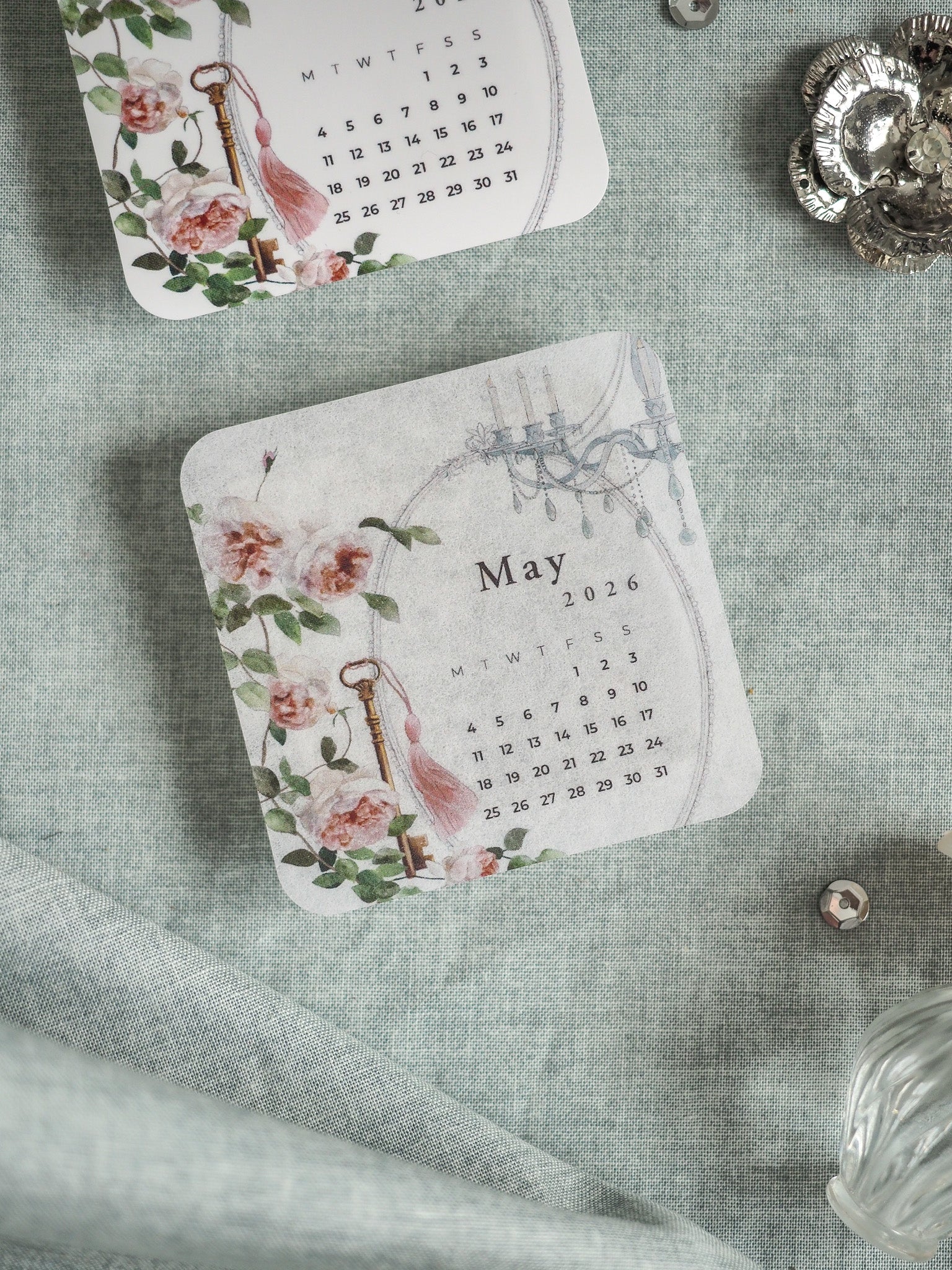 Vintage June 2026 floral calendar featuring a delicate watercolor design of soft pink and red roses and greenery.