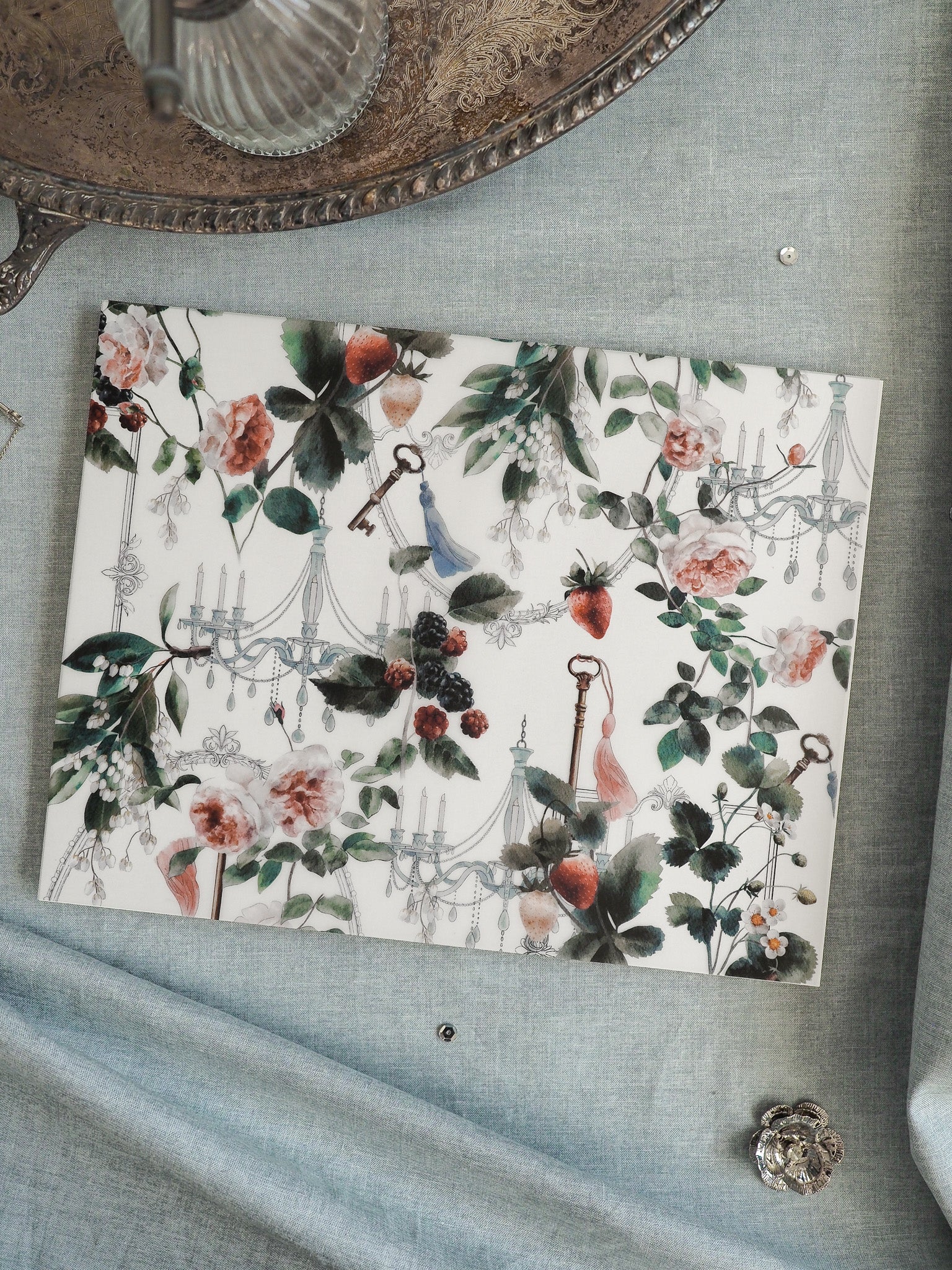 Elegant vintage botanical pattern featuring blush roses, deep green foliage, antique keys, and delicate candlesticks set against a cream background.