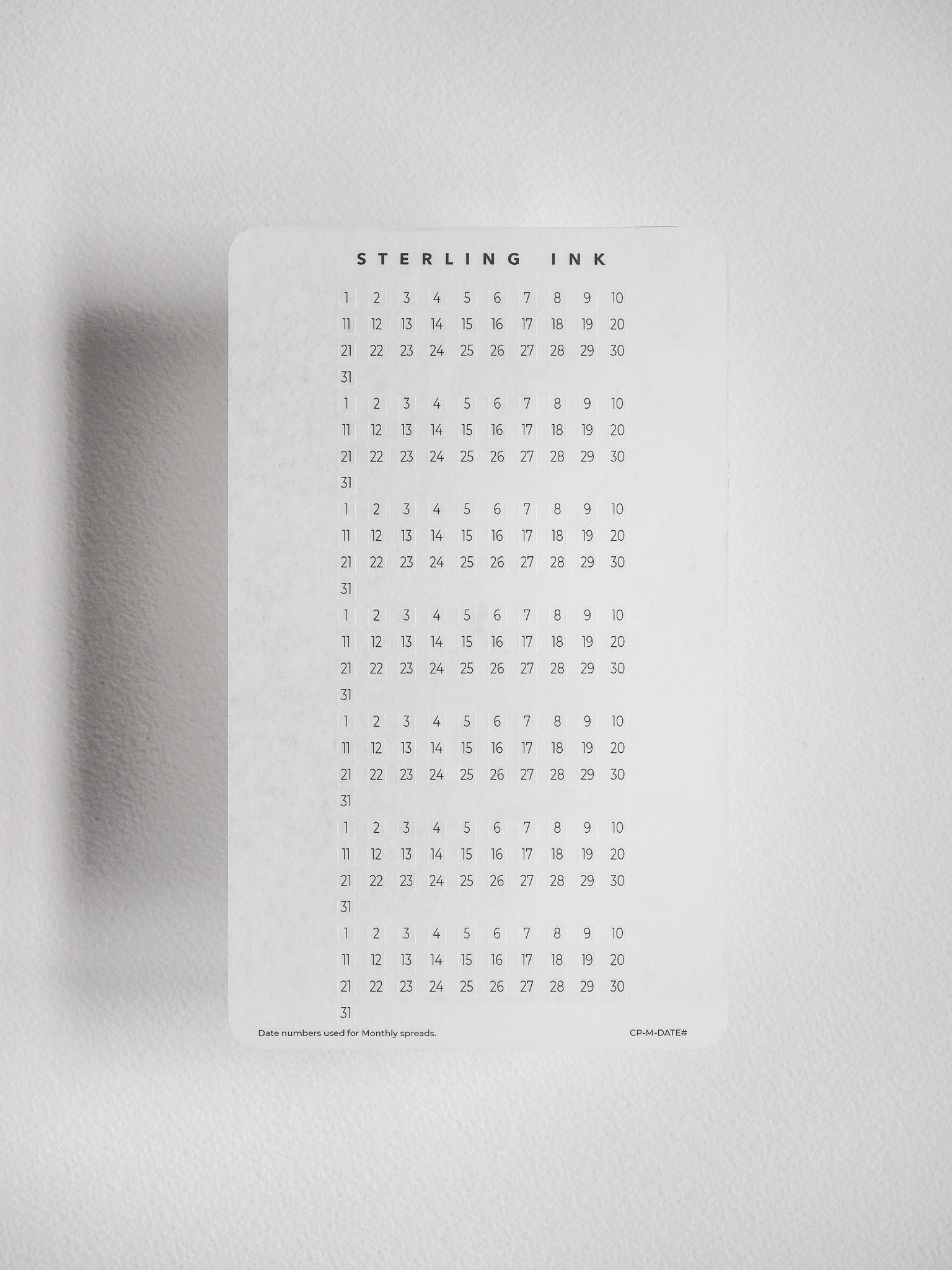 Black-on-white date number sticker sheet featuring a structured calendar grid of dates 1 through 31, ideal for marking flexible dates in undated planners and journals.