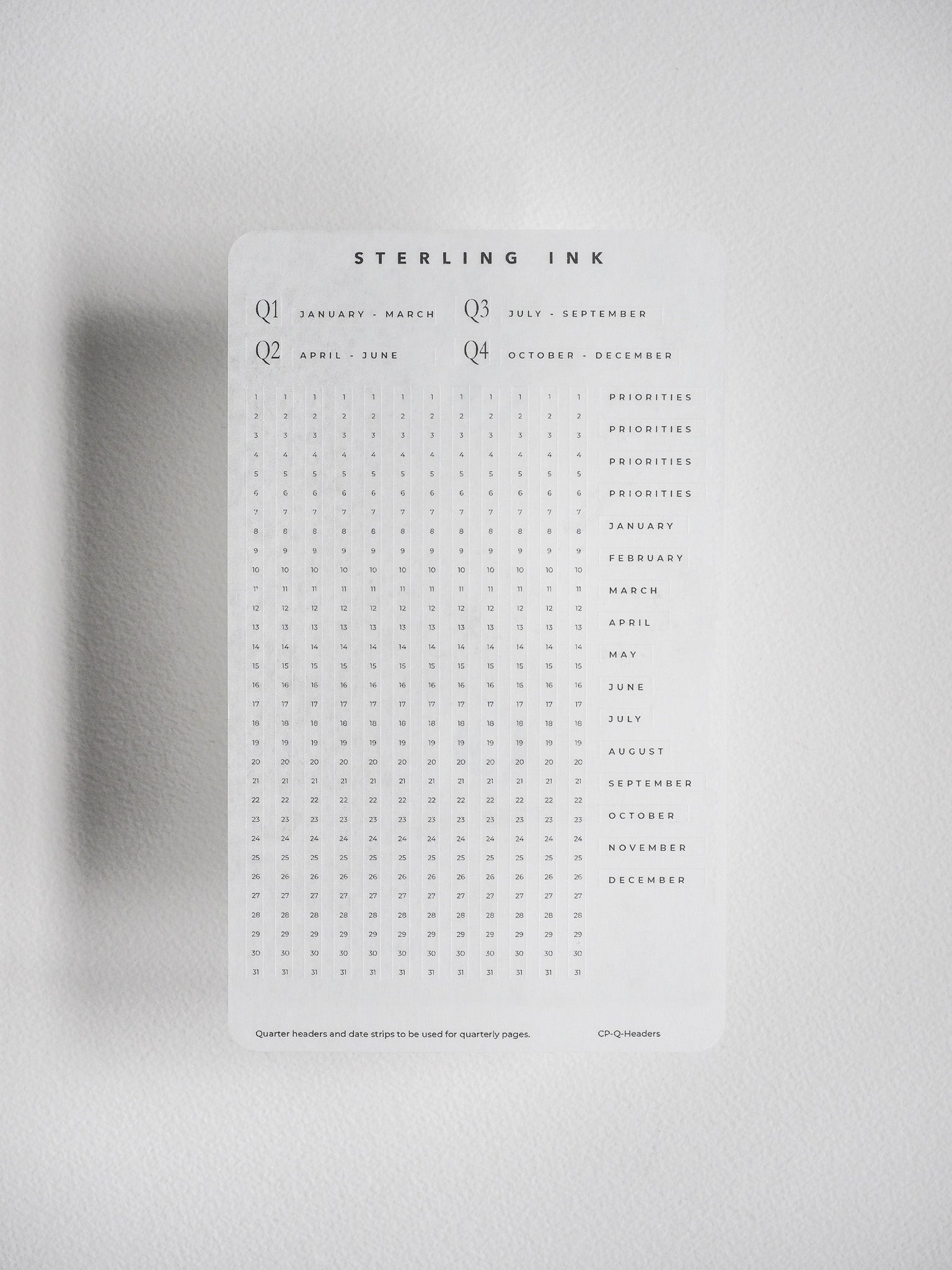 Calendar grid stickers featuring quarters and months for undated planners, providing organized date tracking and seasonal planning compatibility.