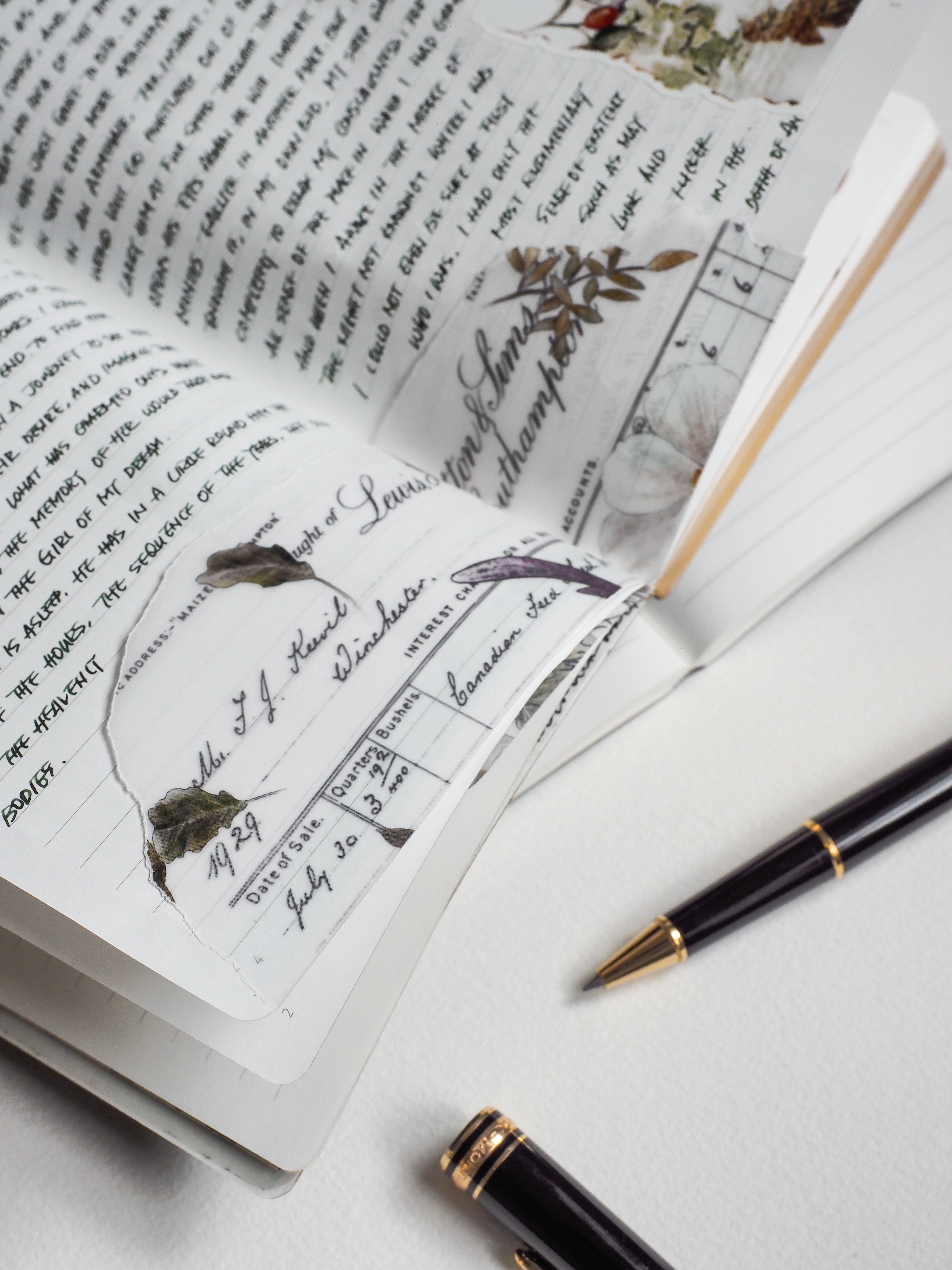 Open A5 notebook showcasing structured, cream-toned journal pages designed with vintage ledger lines, date fields, and ruled writing sections.