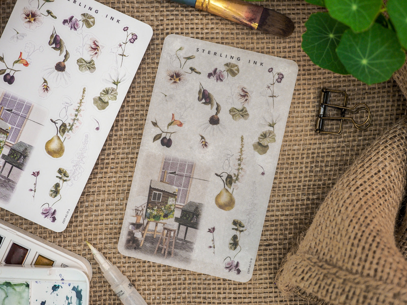 Botanical arrangement stickers titled 'Arrangement Stickers - July 2023', featuring delicate vintage florals, detailed herbs, and small architectural vignettes.
