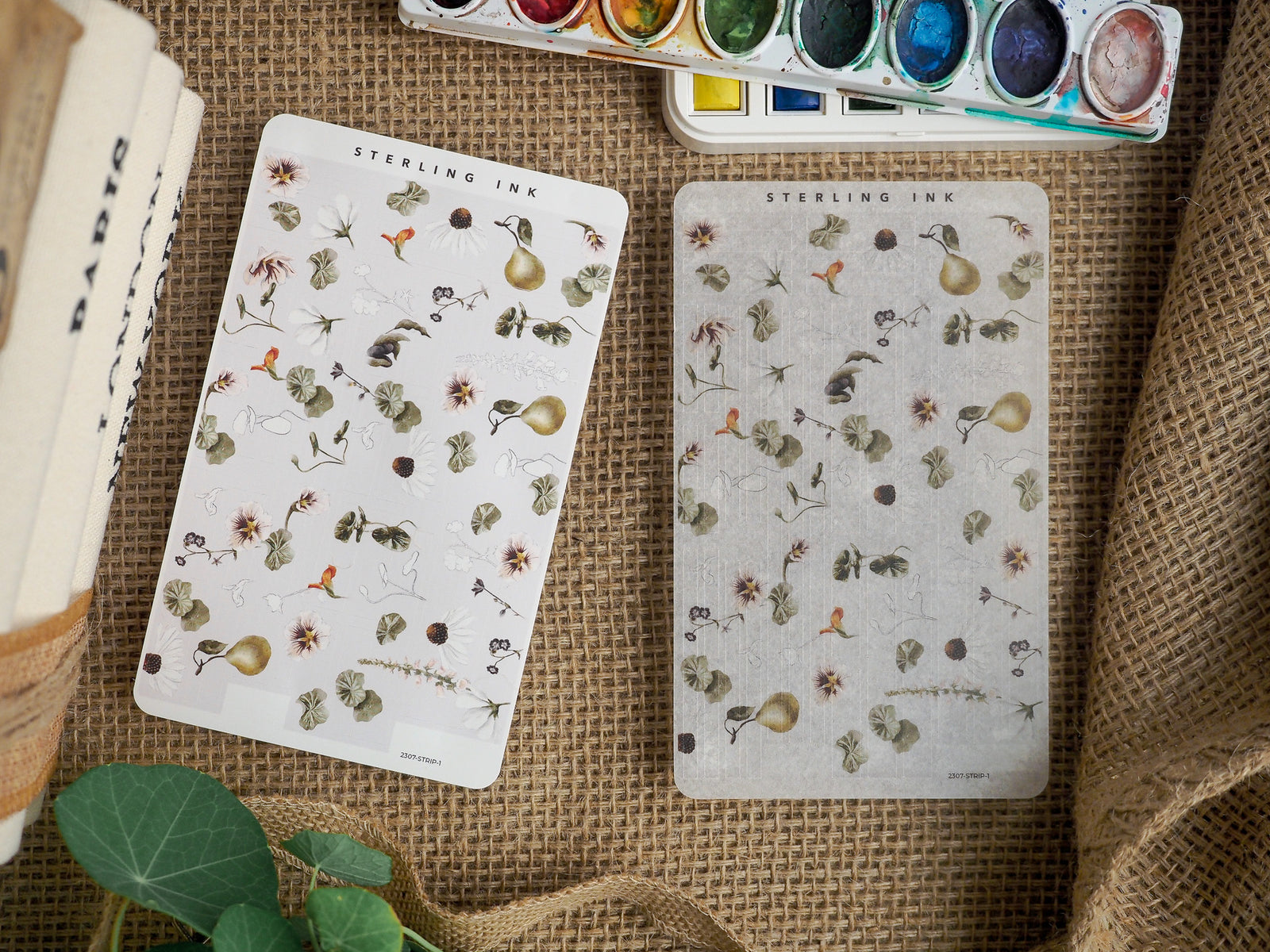 Vintage botanical sticker sheets featuring delicate, detailed illustrations of faded flowers, berries, and natural foliage in muted earth tones.