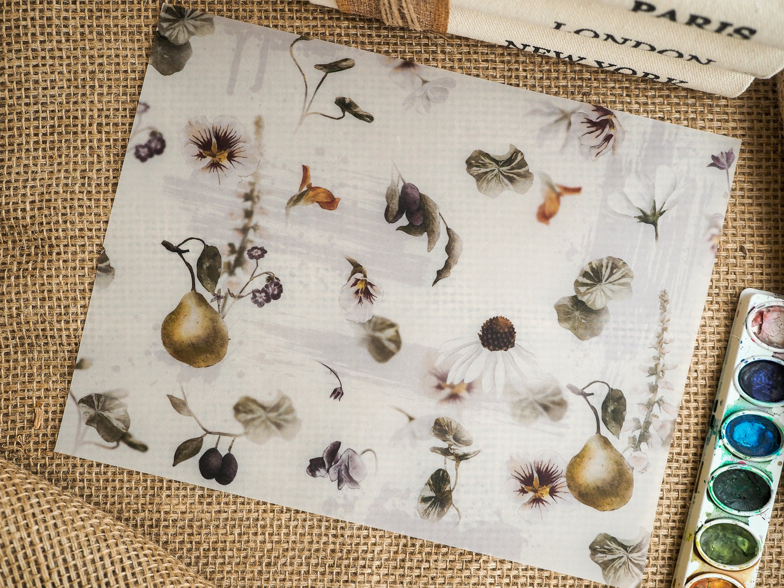 Elegant botanical stationery featuring watercolor depictions of pears, diverse florals, and foliage in soft, earthy tones.