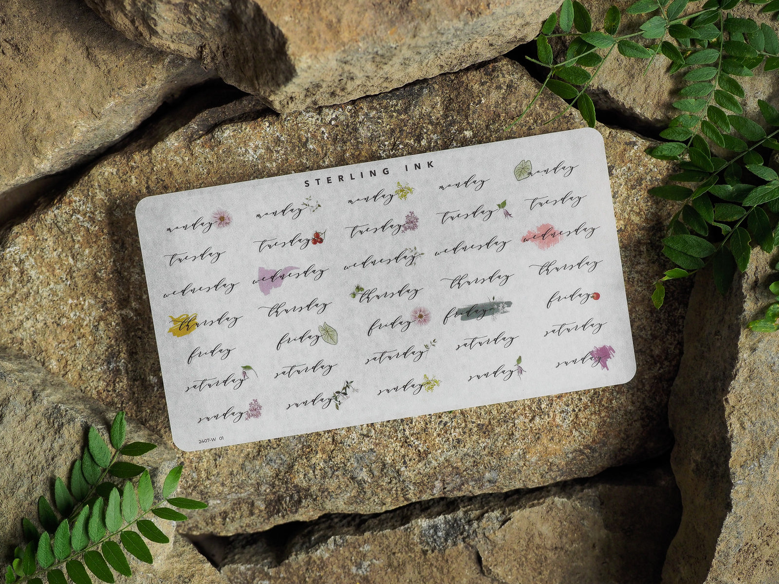 Dainty weekly planner stickers featuring "Monday" through "Sunday" in a delicate script and subtle floral motif, perfect for organizing the days of the week for July 2024.