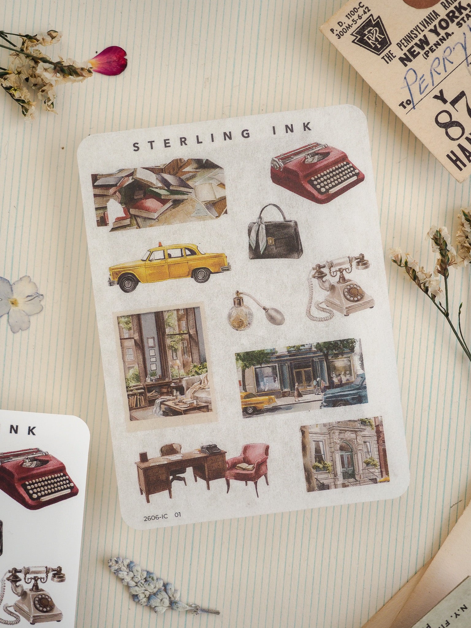 Vintage sticker sheet labeled "STERLING INK," featuring a collection of detailed historical illustrations including classic typewriters, yellow vintage cars, and charming old-fashioned storefronts.