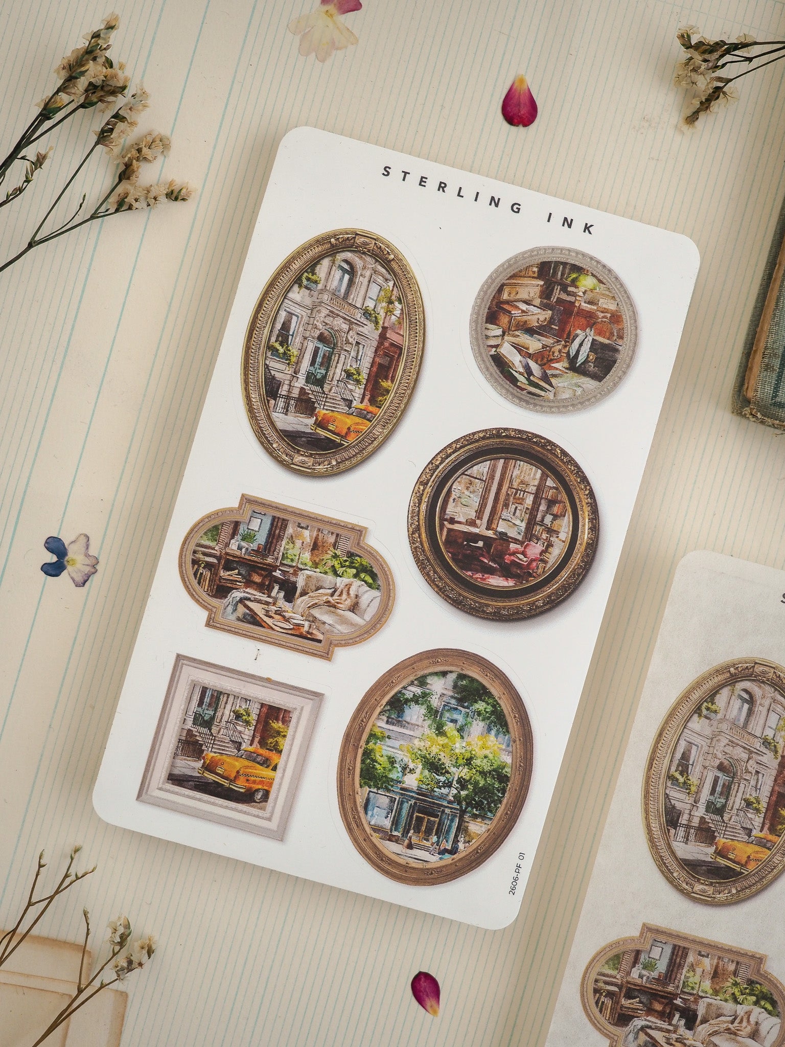 A set of vintage "Sterling Ink" stickers featuring multiple distressed circular photo designs depicting nostalgic European streetscapes and interior scenes.