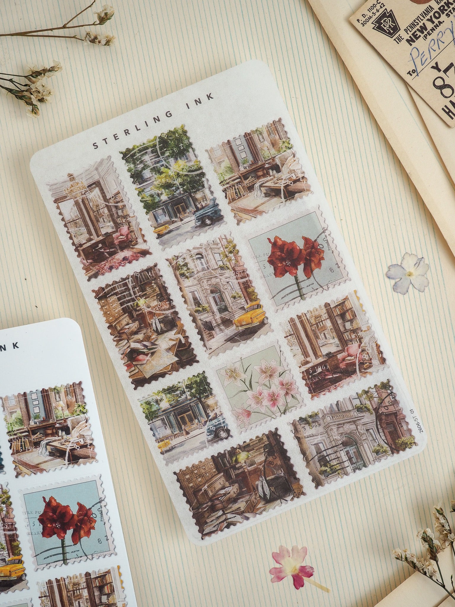 Vintage mini-postcard sticker sheet from Sterling Ink featuring a charming collage of sepia-toned European cityscapes, historic buildings, and rustic urban scenes.