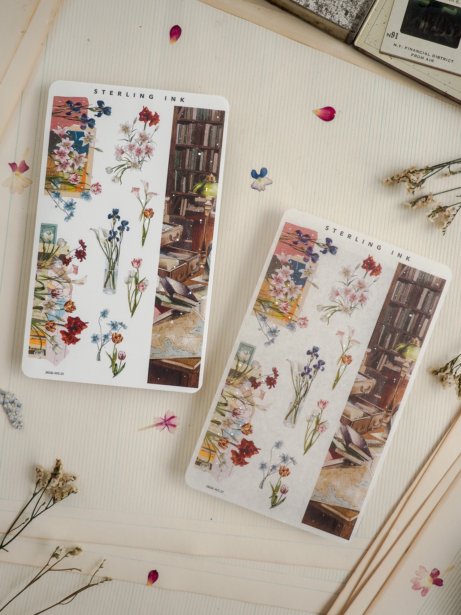 Two floral botanical sticker sheets featuring watercolor renderings of wildflowers and roses displayed in vases against a rustic backdrop of stacked books, labeled "STERLING INK."