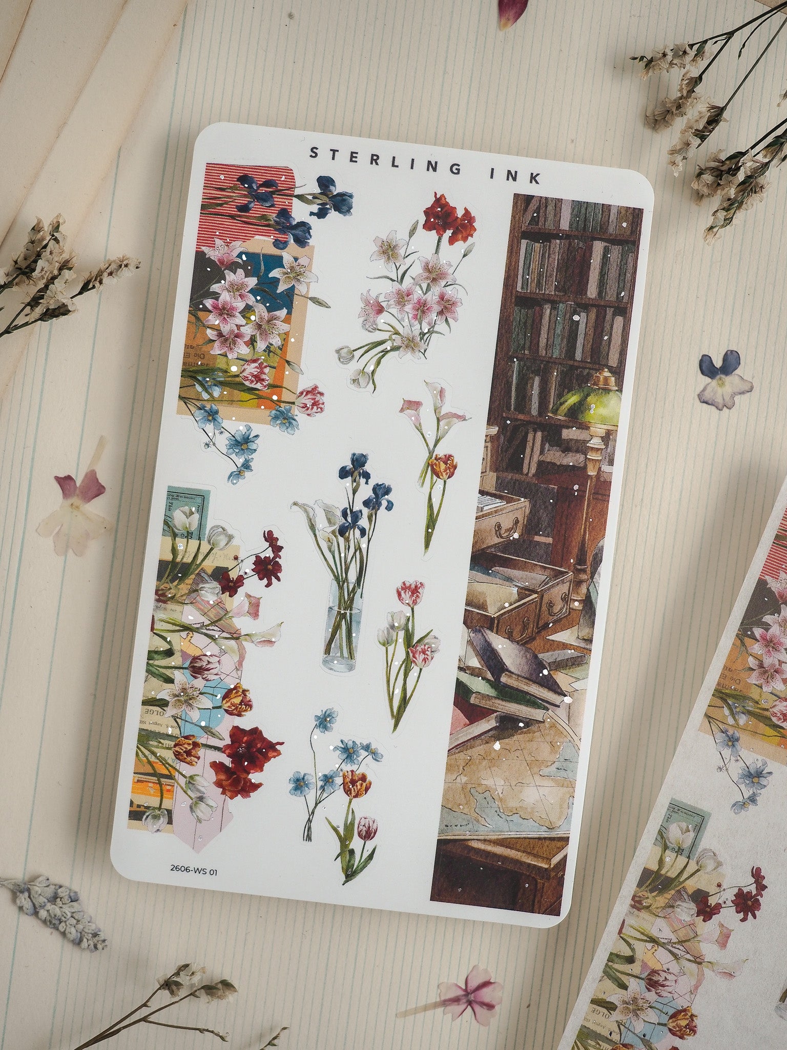 A craft sheet featuring a vibrant collage of watercolor flowers above a detailed illustration of a vintage, dark wood library bookcase, perfect for floral and scholarly themes.