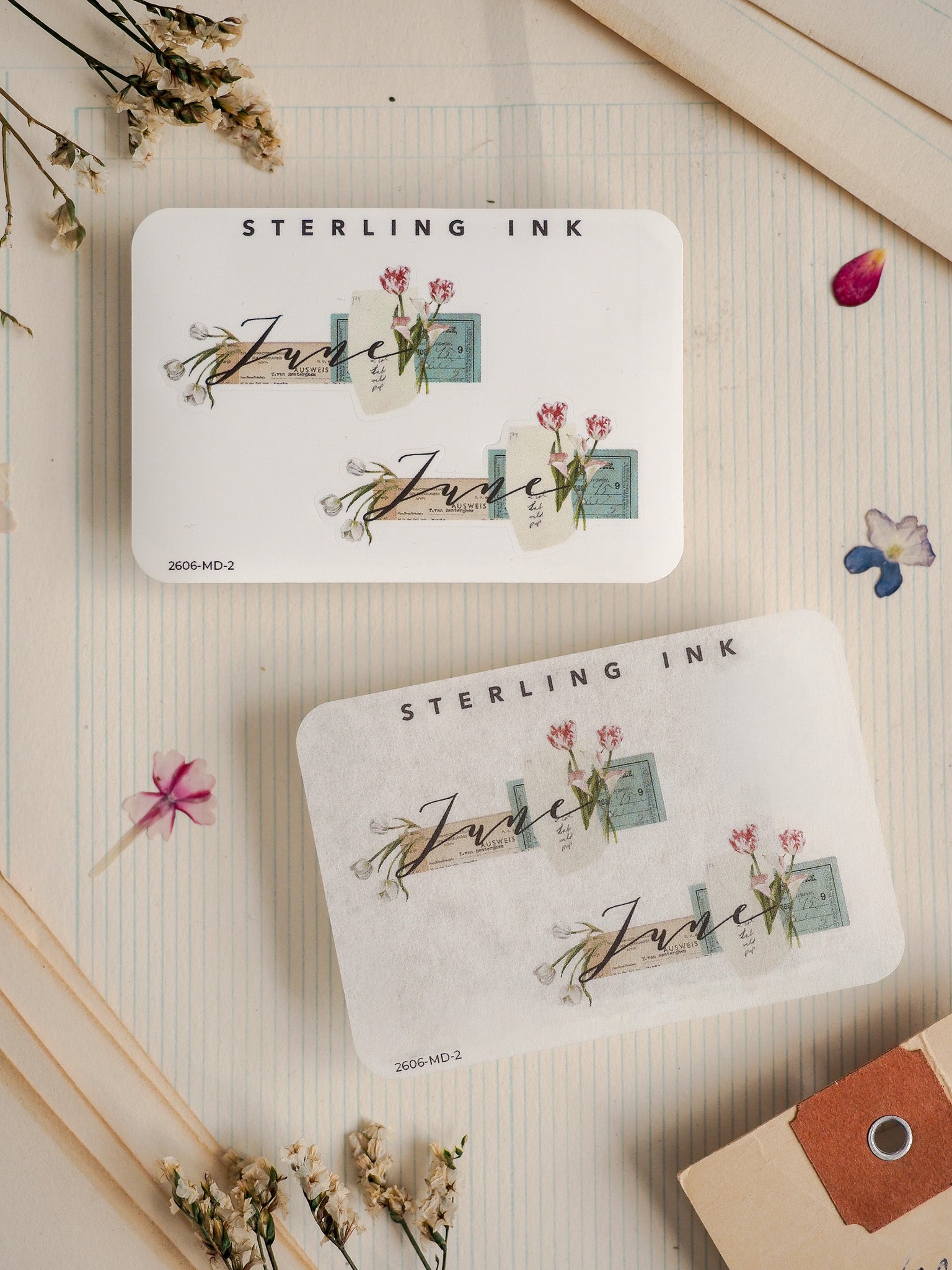 Elegant, cream-colored "Sterling Ink" sticker labels featuring romantic watercolor florals, green foliage, and the name "June," perfect for scrapbooking.
