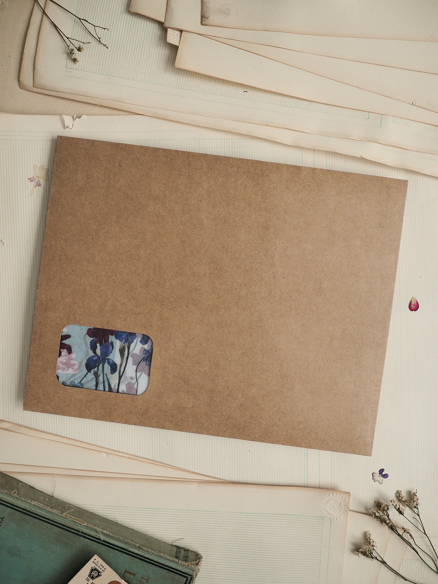 Kraft brown card stationery featuring a delicate watercolor sticker design of blue and purple flowers.
