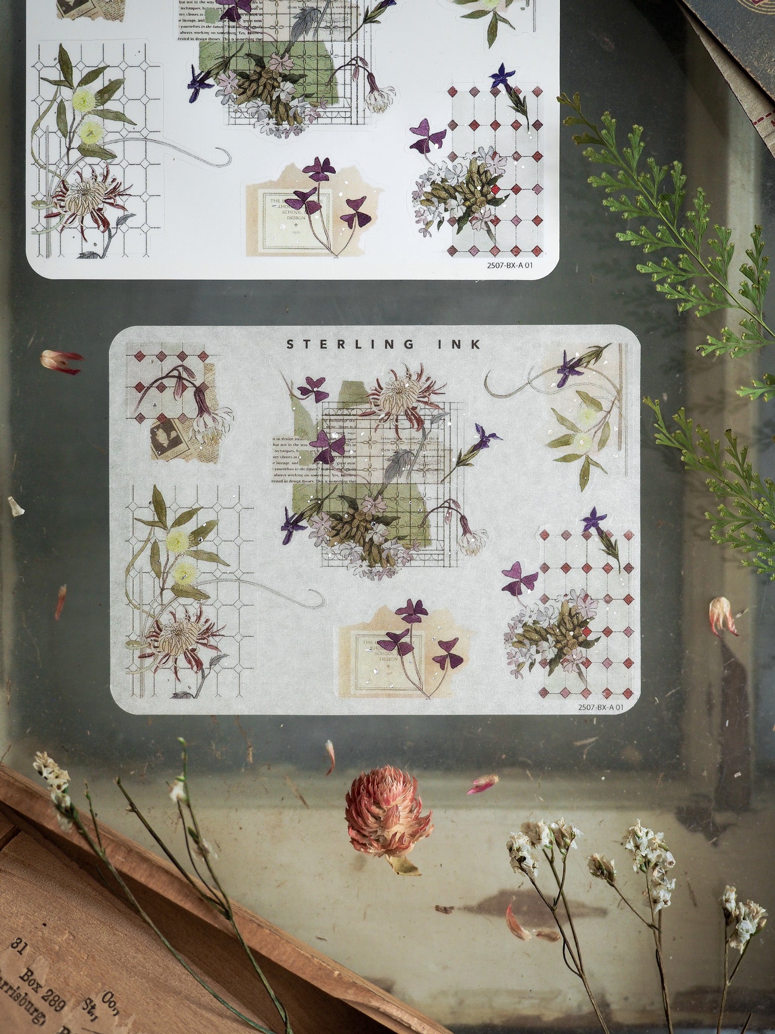Muted botanical sticker sheets featuring detailed corner elements, delicate floral groupings, and lush green foliage in a natural, earthy palette.