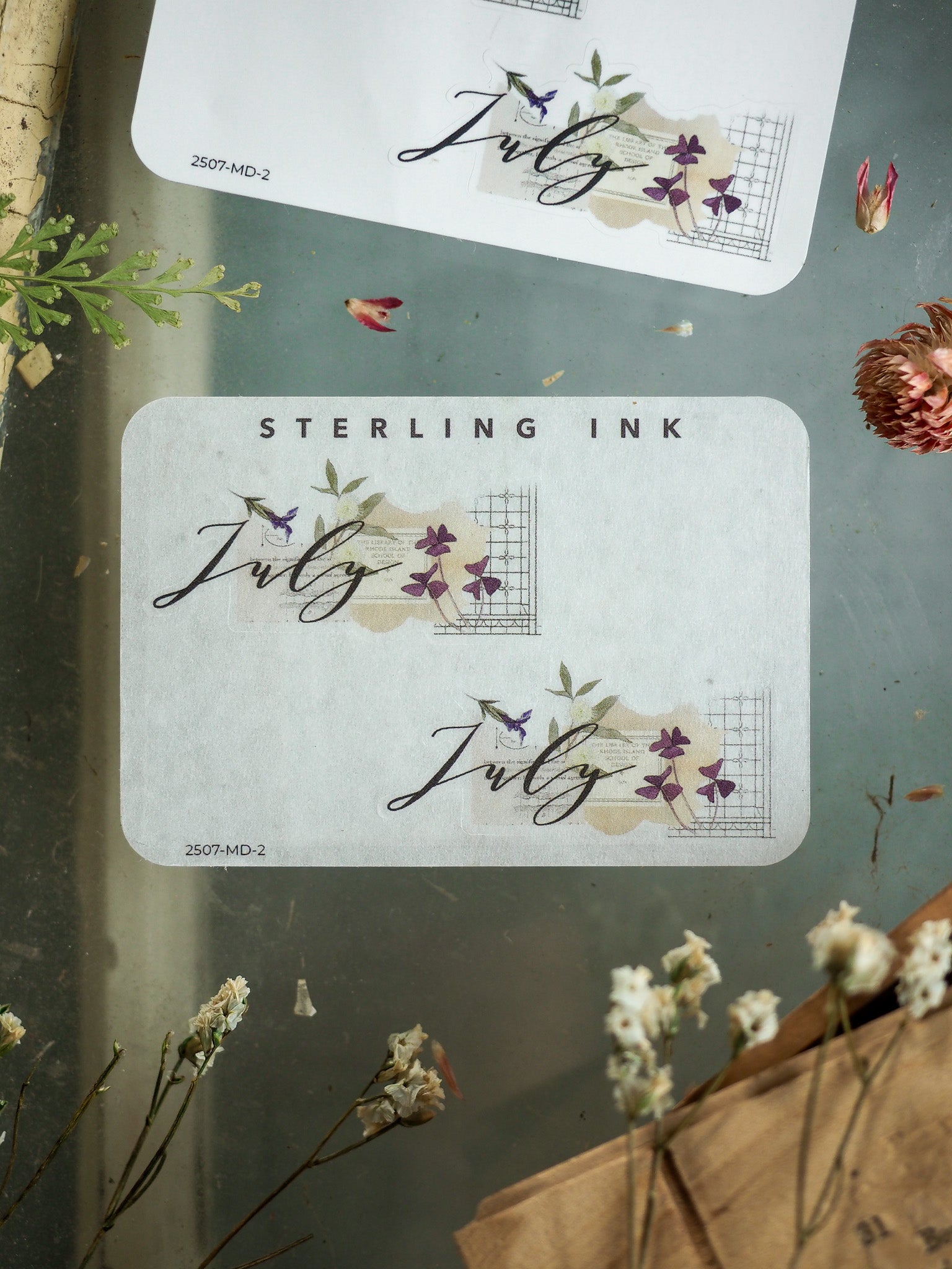 Elegant July month sticker set featuring flowing calligraphy and soft watercolor floral accents, perfect for organizing seasonal planners and journals.