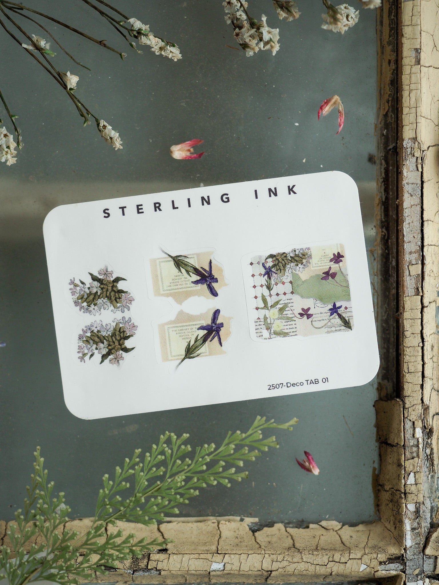 Watercolor-style decorative tabs showcasing delicate botanical illustrations of wildflowers, leaves, and stems in muted purples, greens, and soft lavenders.