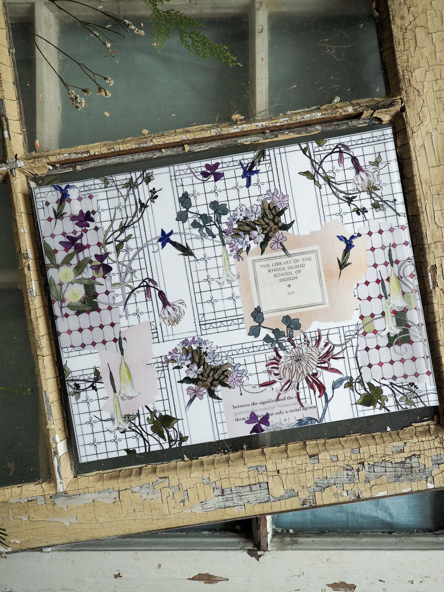 Vintage stationery featuring a delicate botanical arrangement of purple and white flowers set within a decorative black grid pattern.
