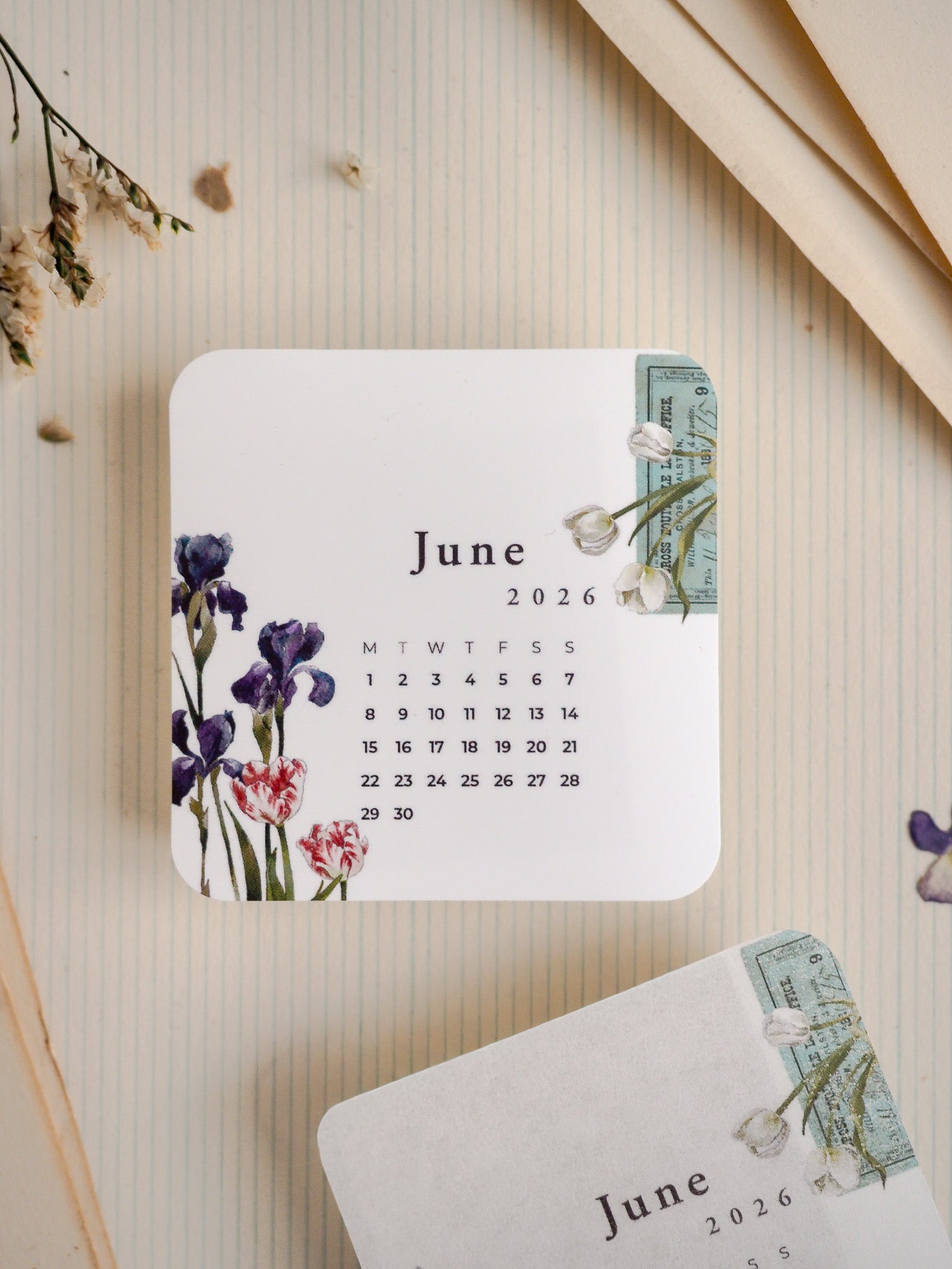 A sweet June 2026 planner set featuring a white monthly calendar adorned with delicate purple and red floral accents, paired with a complementary sepia-toned stationery card.