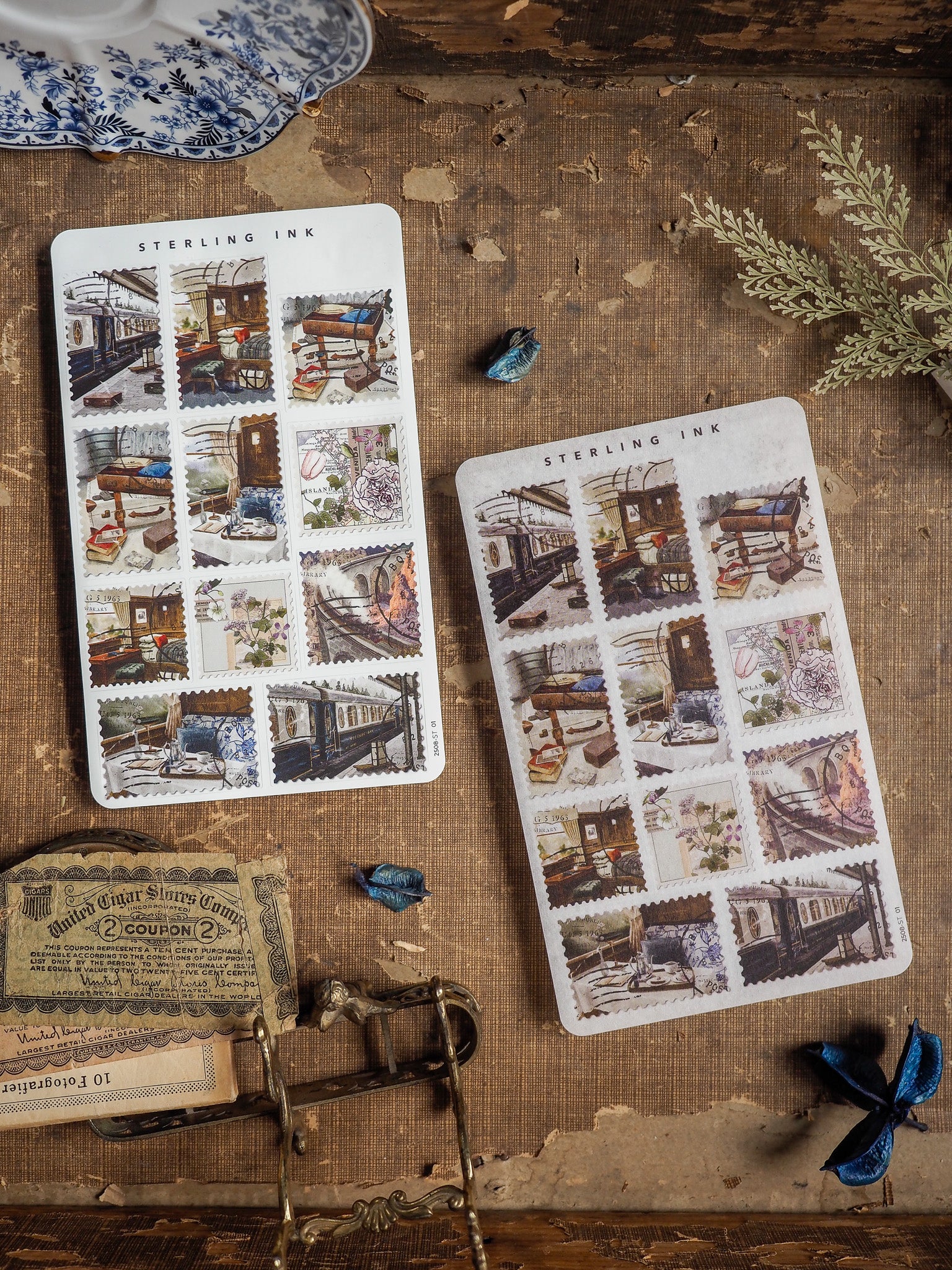 Vintage "Sterling Ink" stamps stickers featuring sepia-toned groupings of nostalgic illustrations depicting rustic train scenes, historic architecture, and detailed natural vignettes.
