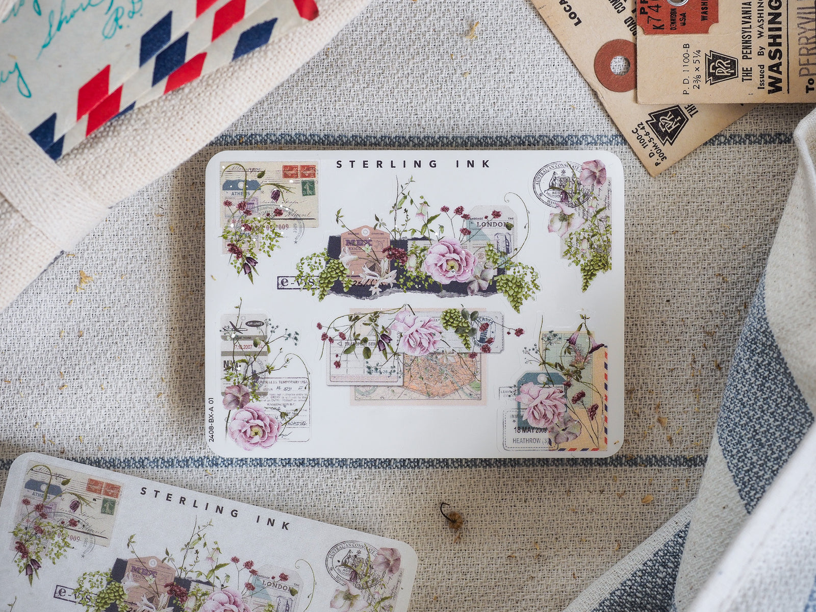 Vintage "Sterling Ink" sticker sheet featuring ornate edges and corners with delicate floral motifs, stamp details, and charming London scenes for crafting.