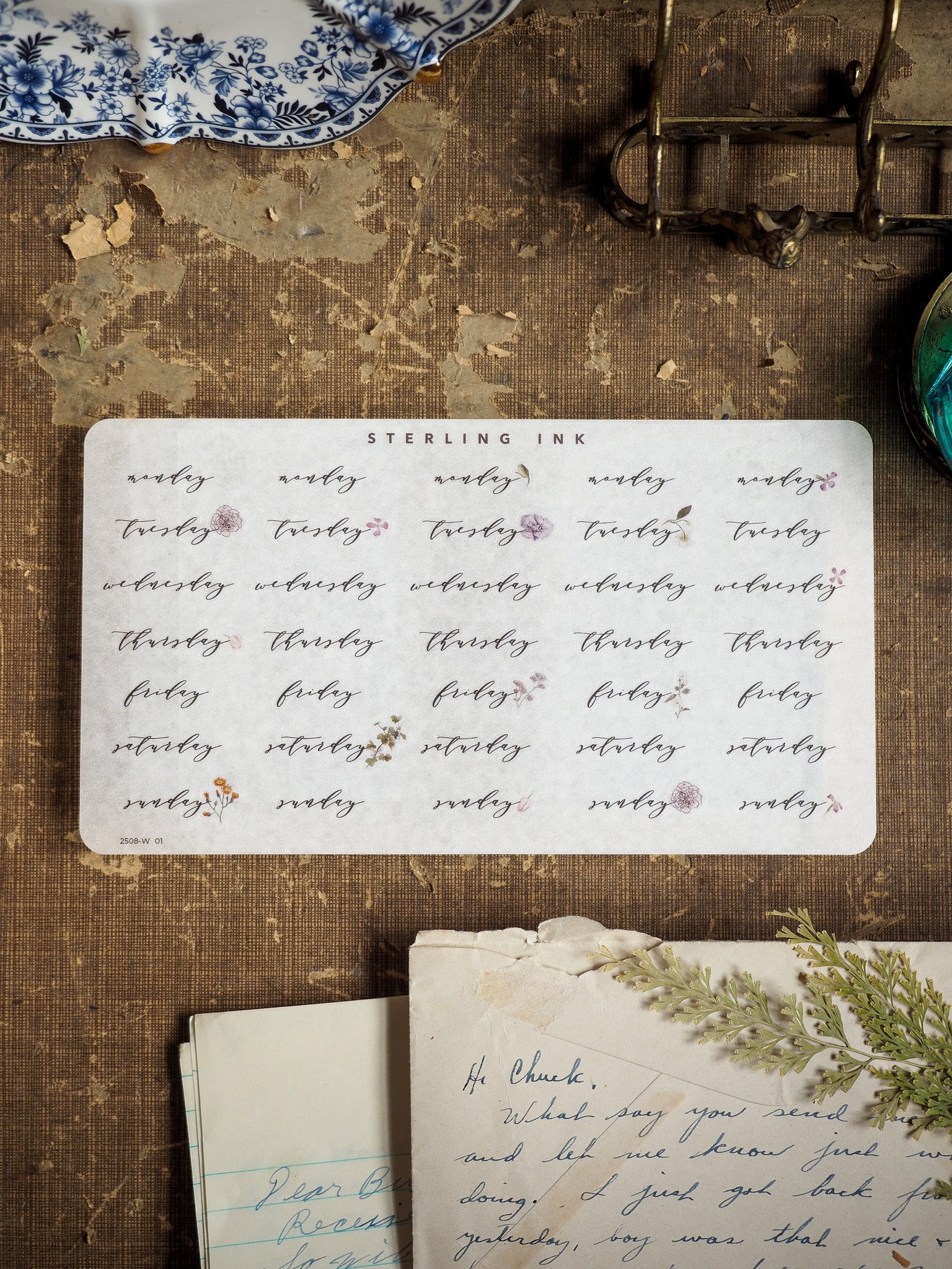A comprehensive set of creamy white weekday calendar stickers designed for journaling and planning, labeling days from Monday to Sunday in a structured grid pattern.