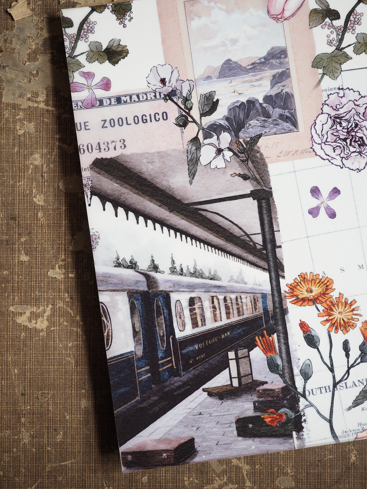 Vintage planner featuring a detailed black-and-white illustration of a historic train platform and locomotive, framed by delicate botanical sketches and soft typography.