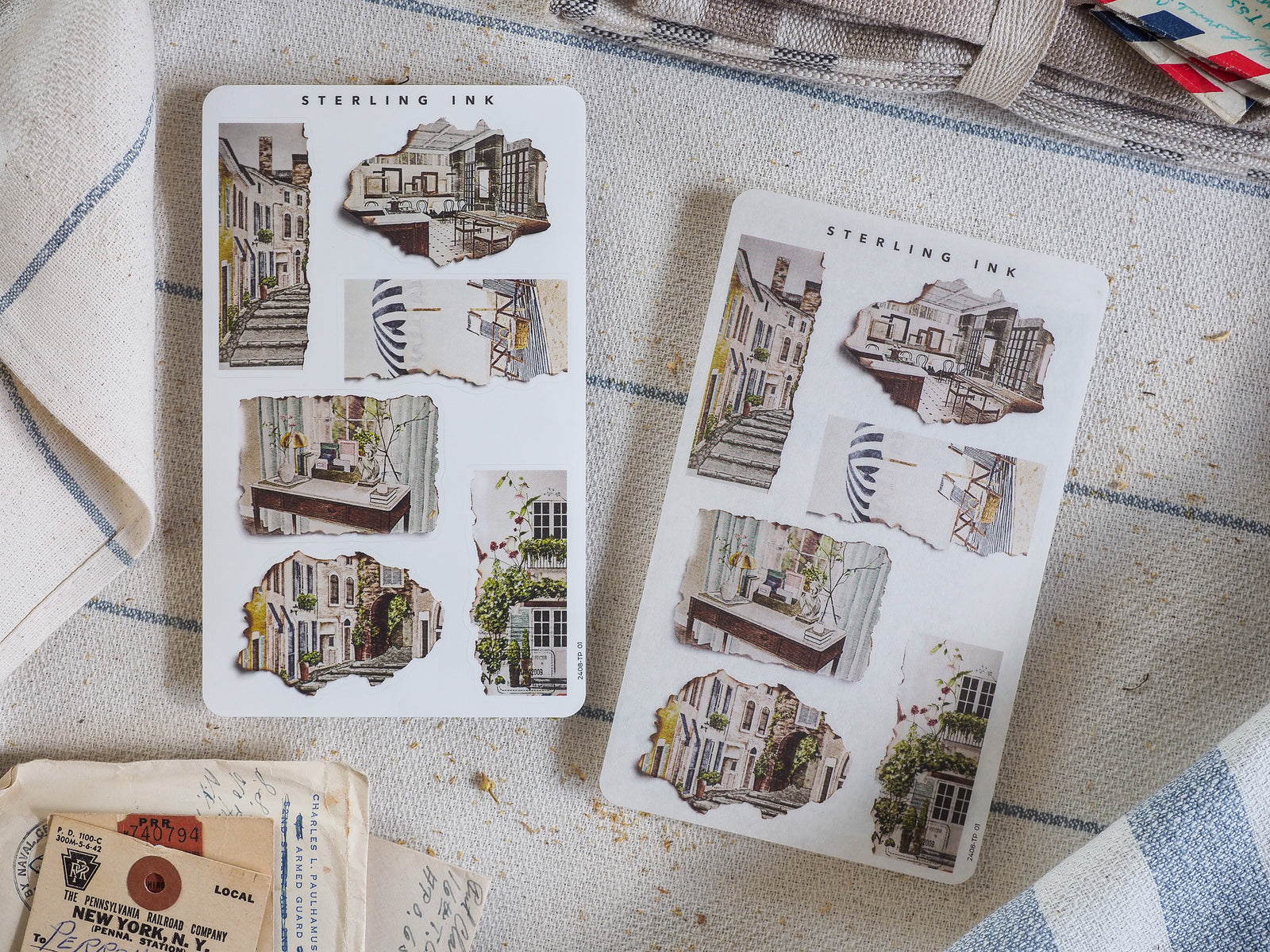 Detailed collection of "Sterling Ink" torn paper stickers showcasing charming, vintage architectural sketches of historic European city streets and buildings.
