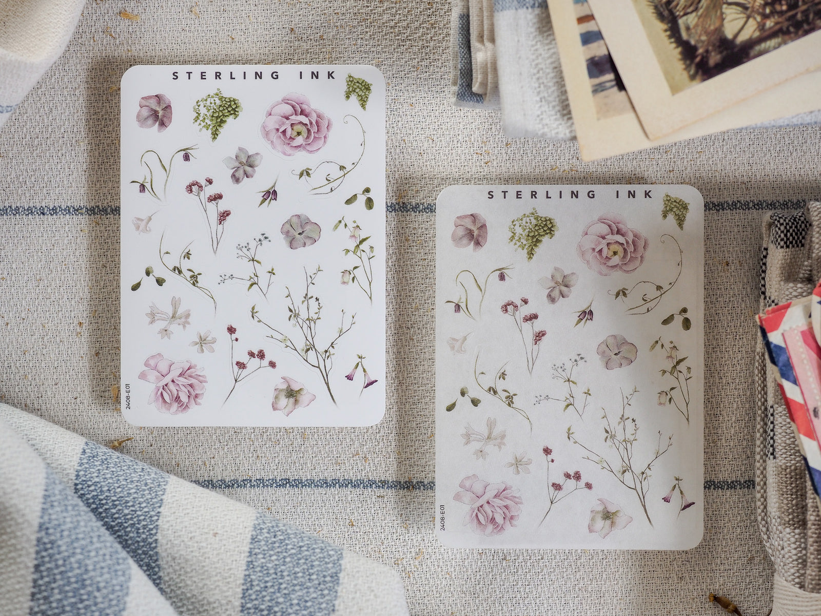 Botanical sticker sheet set from Sterling Ink featuring delicate pressed florals, including pink roses and assorted green woodland foliage.