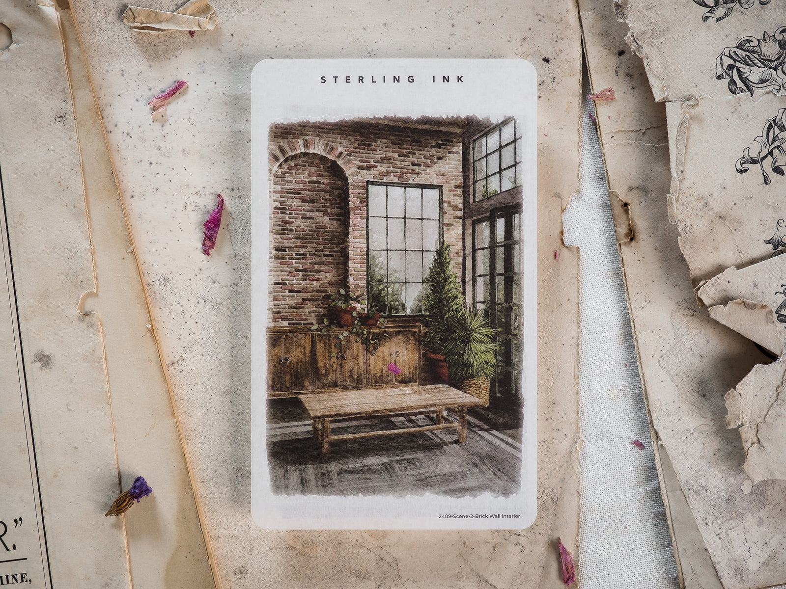 Rustic, sepia-toned sticker featuring an industrial-chic interior scene: exposed brick walls, large windows, a wooden table, and lush greenery.