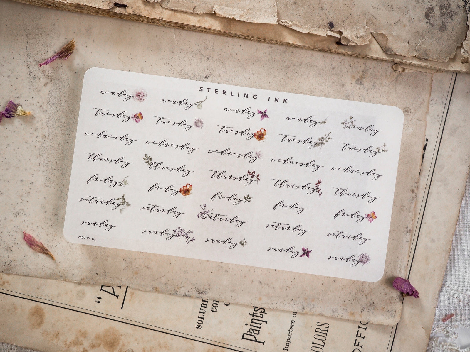 Sticker set featuring nine calendar labels with elegant calligraphy and accompanying floral designs, perfect for decorating daily journals or planners.