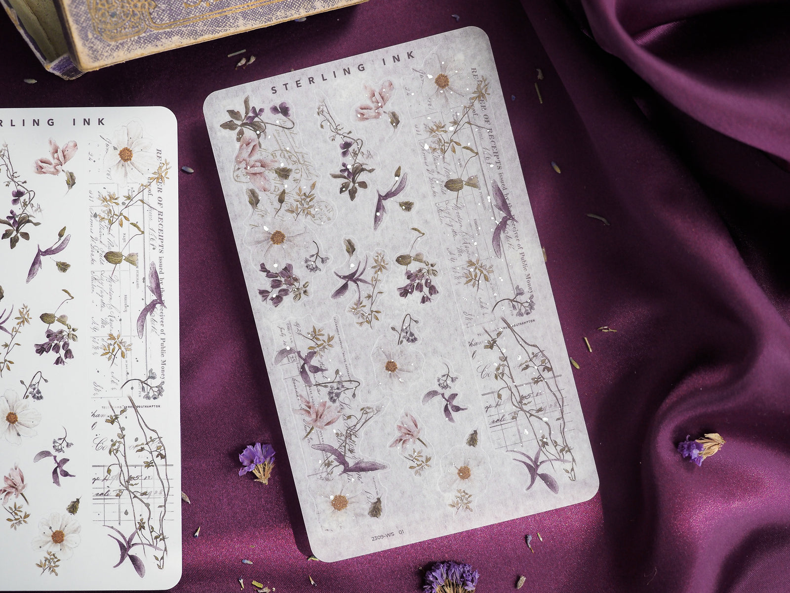 Vintage botanical sticker sheet featuring pressed purple and cream flowers mixed with delicate script and sepia-toned leaf illustrations for September crafting.