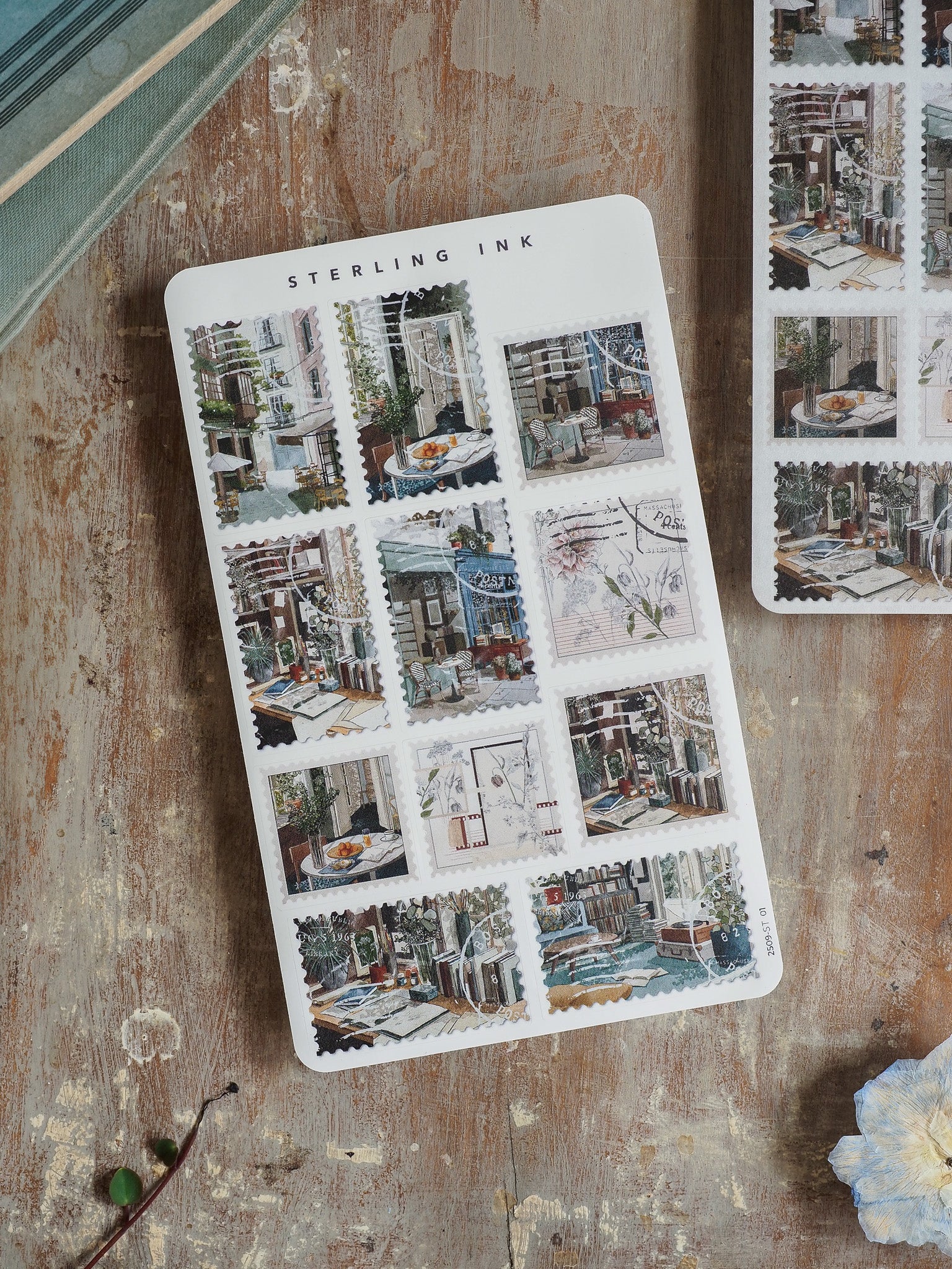 Collection of decorative "Sterling Ink" stickers showcasing quaint European streets, cafes, and charming architectural scenes.