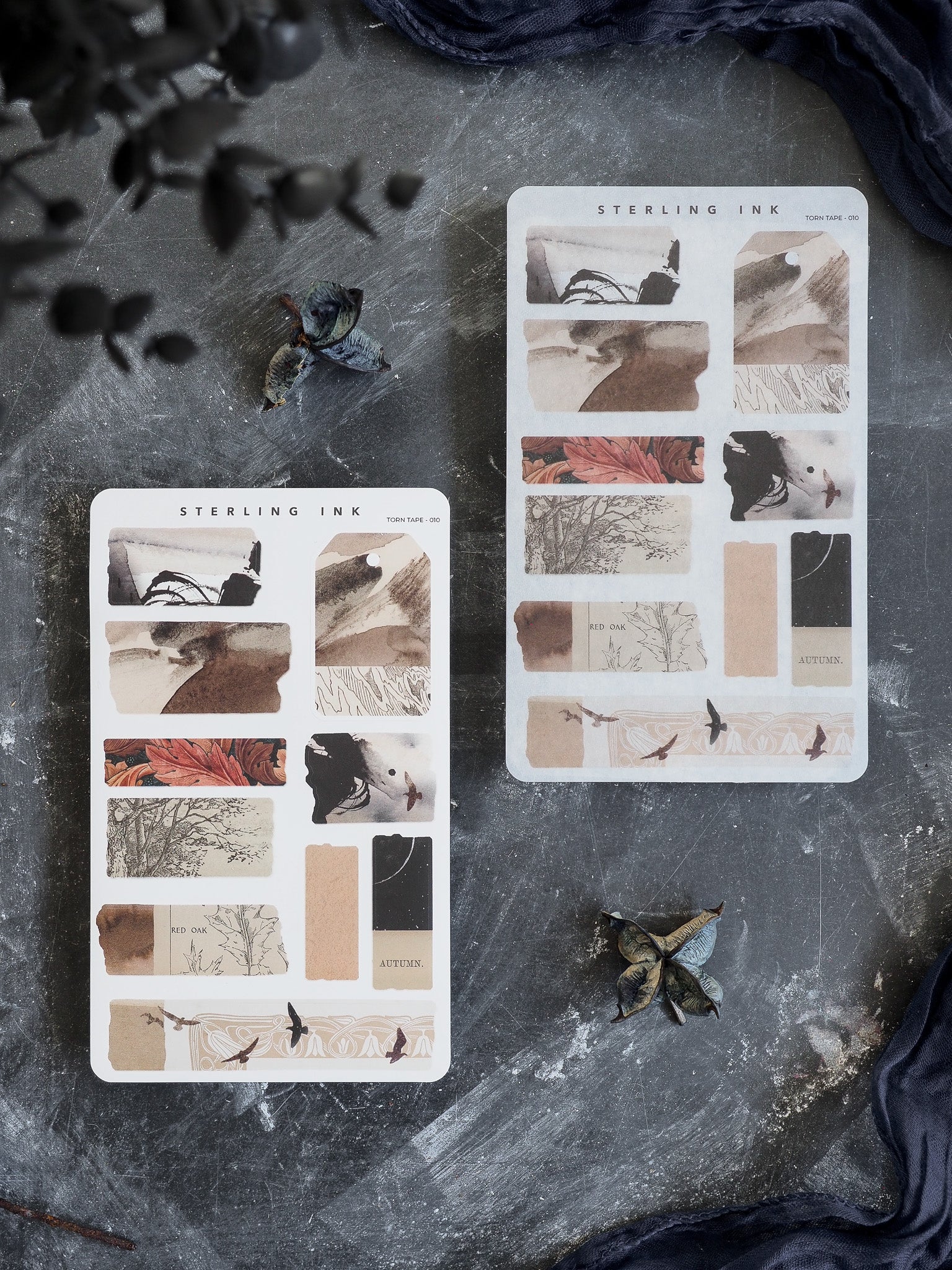 A decorative sticker sheet themed for autumn, featuring collages of red oak leaves, rustic foliage, and distressed natural paper textures for seasonal journaling.