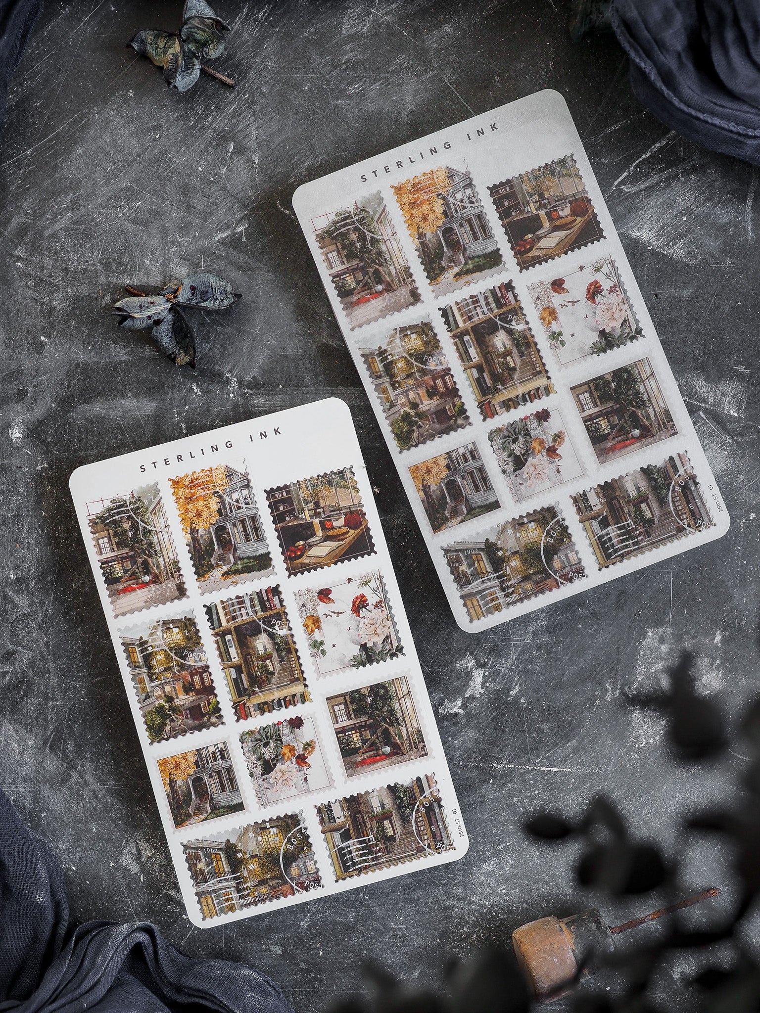 Autumn-themed sheet of decorative stamps stickers featuring detailed engravings of rustic, old-world buildings and spooky October street scenes.