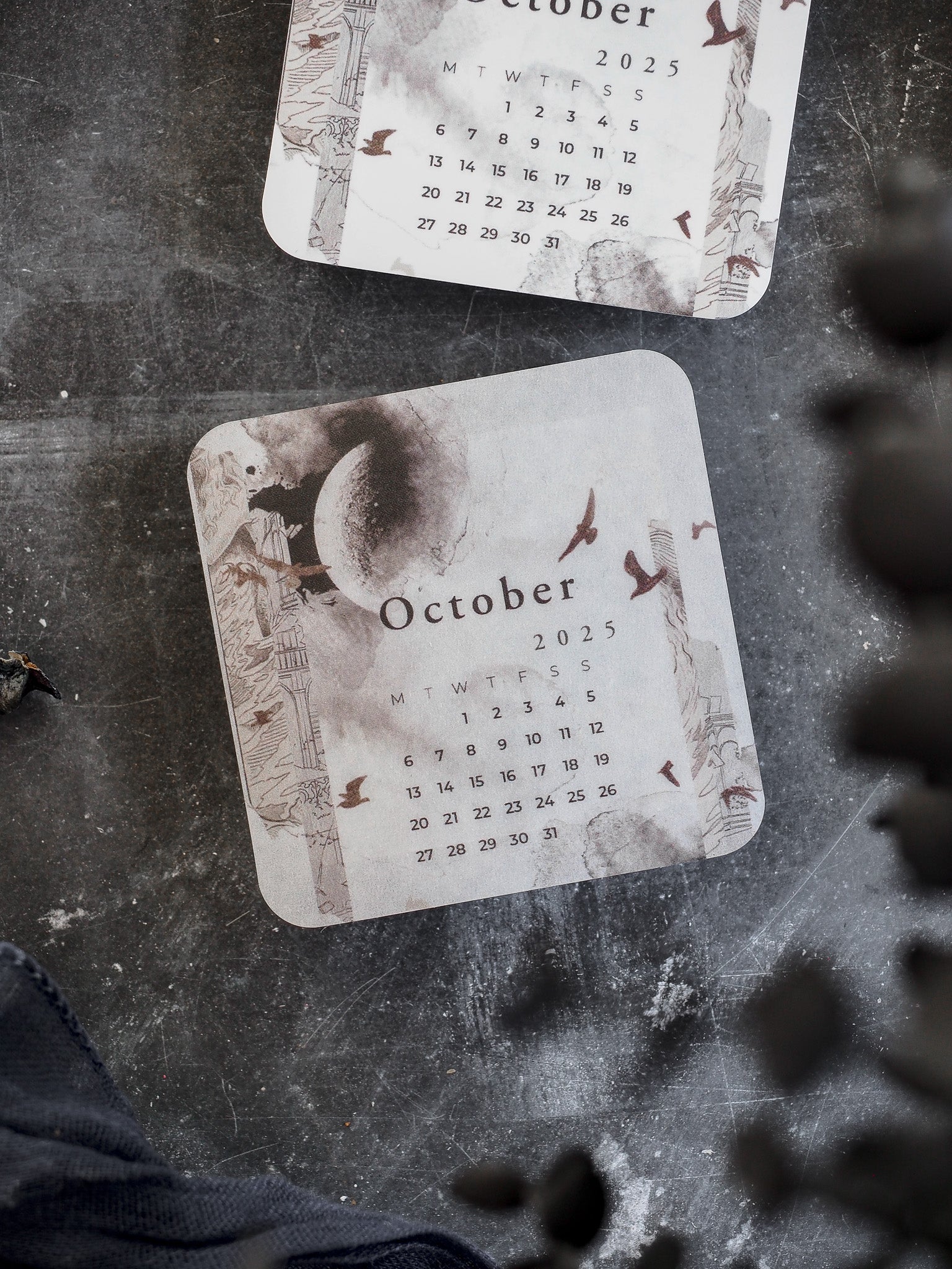 October 2025 monthly calendar featuring an autumnal watercolor design with decorative pumpkins, falling leaves, and rustic natural tones.