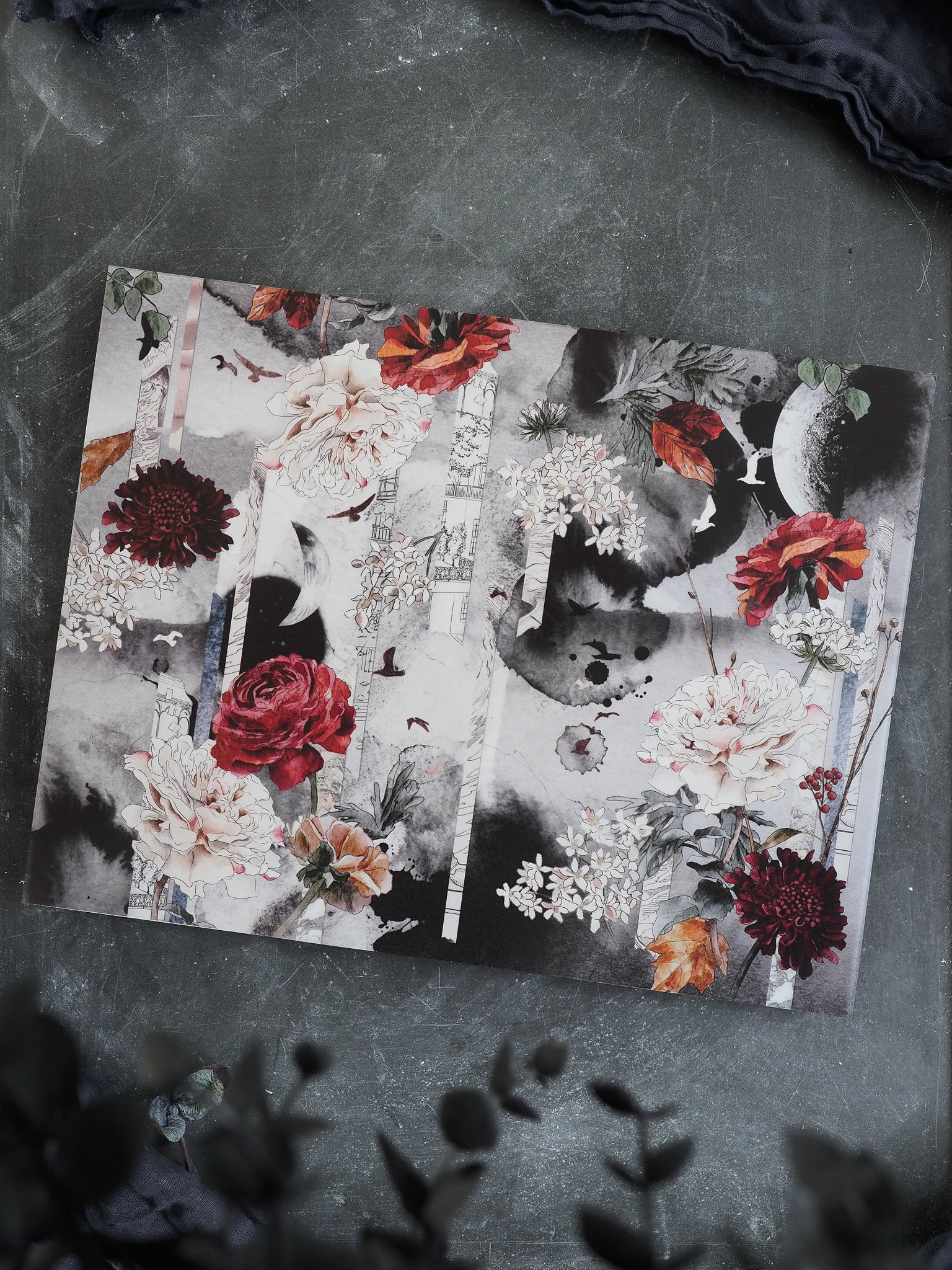 Vellum October 2025 planner cover featuring a romantic, dramatic botanical print of lush autumn florals in deep reds, creams, and muted greens.
