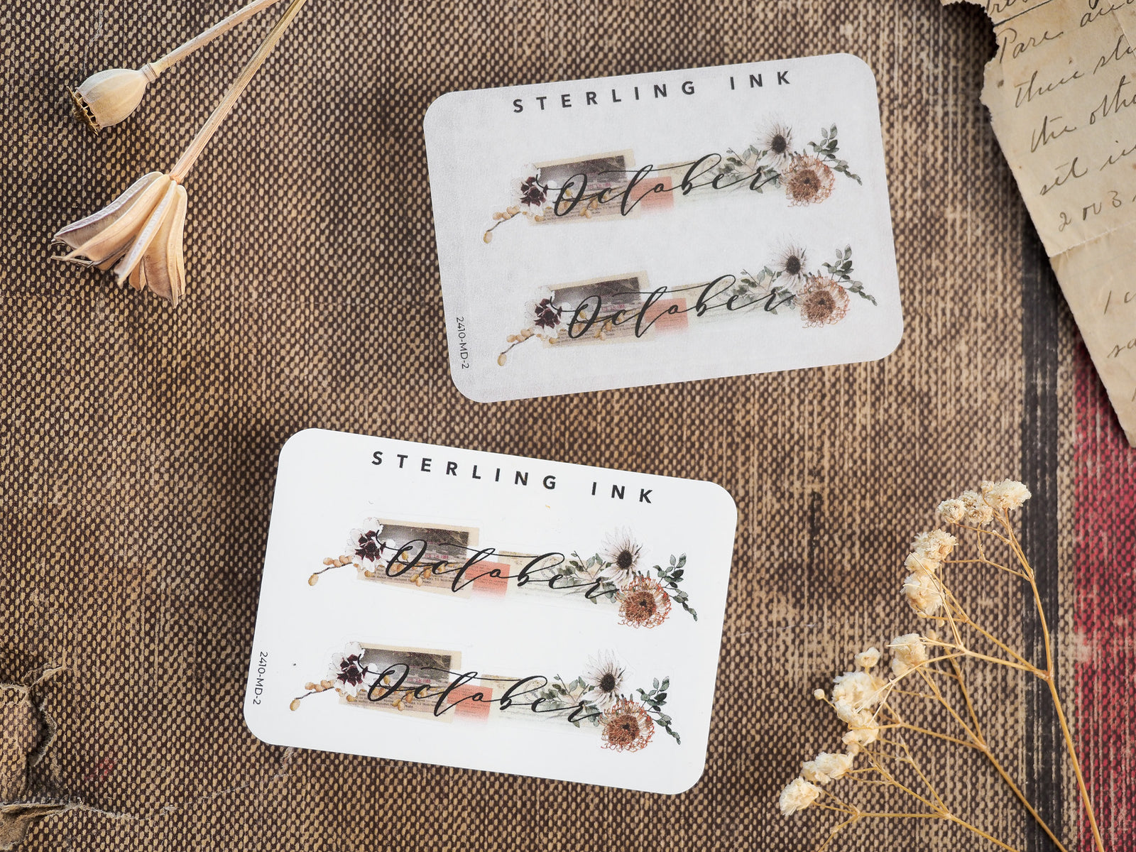 Decorative "October" month sticker labels featuring rustic, earthy botanicals, dried fall flowers, and seasonal accents perfect for journaling and planners.