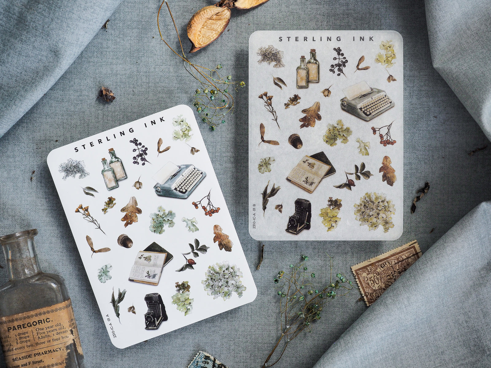 Sticker sheets featuring a fall-themed collection of vintage icons, including botanical elements, antique typewriters, and apothecary bottles.