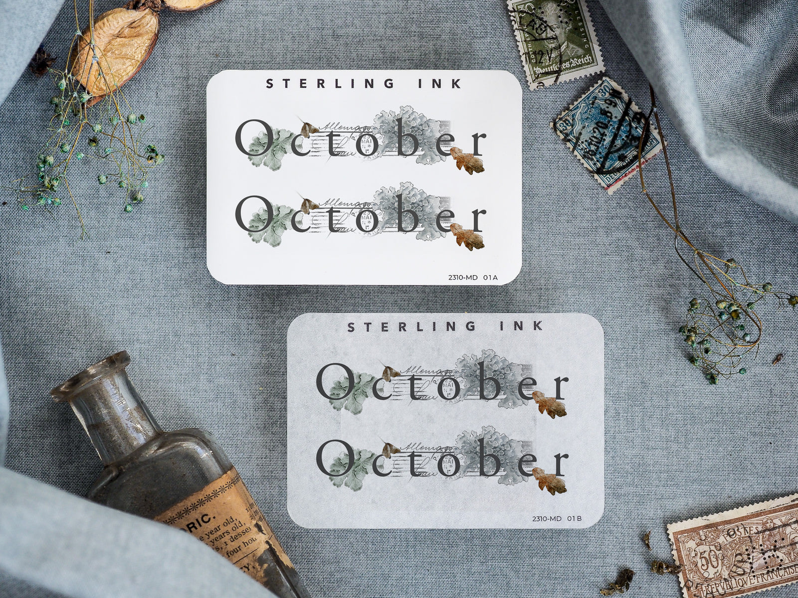 Rustic monthly planner stickers with "October" text, beautifully framed by muted watercolor botanical elements and delicate autumnal foliage.