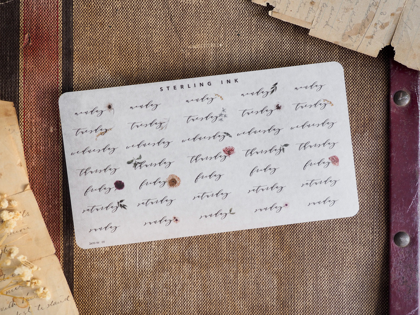 Rustic planner stickers featuring individual weekdays stamped in rich sepia brown ink, perfect for journaling and decorating a daily calendar spread.