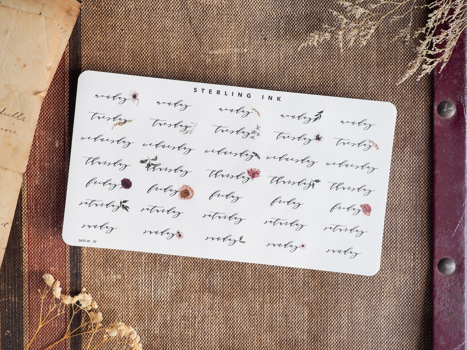 Decorative grid of weekly stickers featuring days of the week, printed in varying deep brown and maroon ink, perfect for October 2024 planning and bullet journaling.
