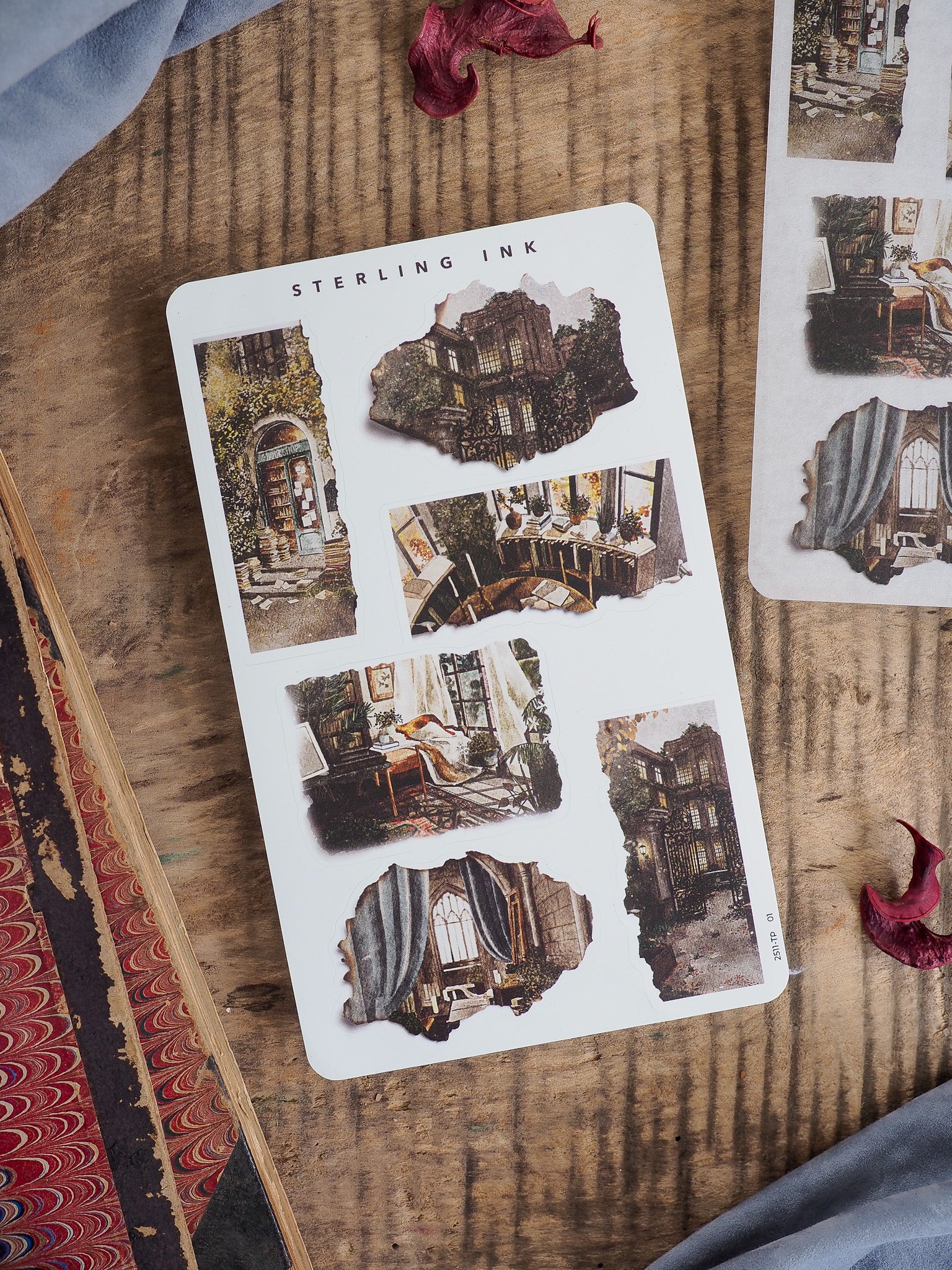 Vintage "Sterling Ink" sticker sheet featuring distressed, torn-edge designs and moody architectural images of old facades, windows, and dark interiors.