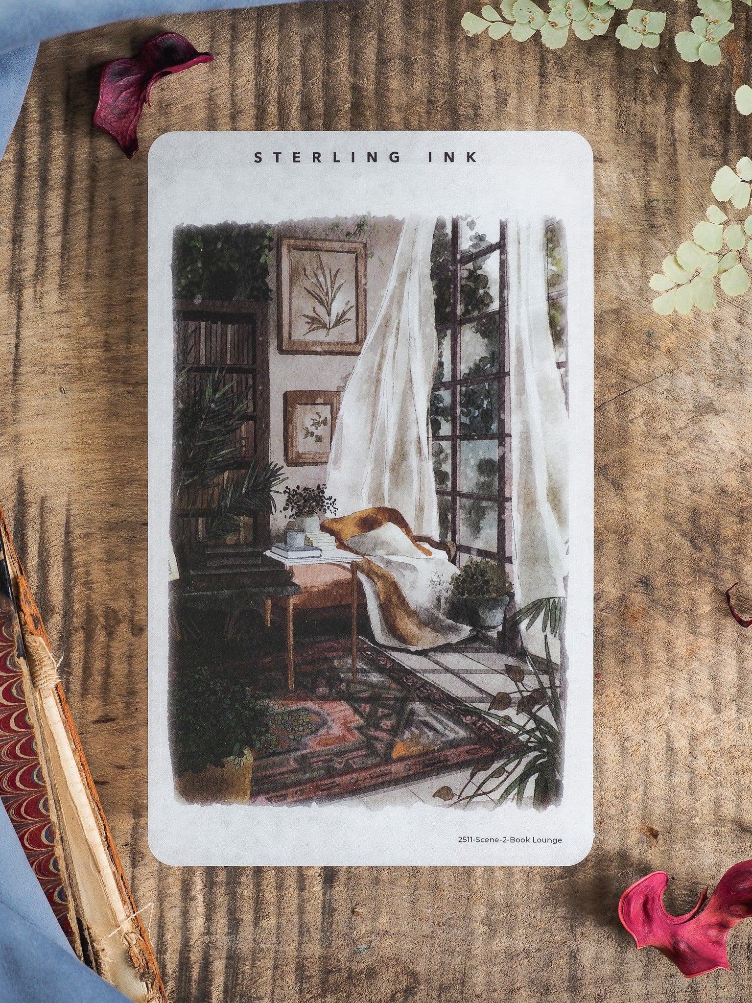 Vintage-style sticker depicting a warm "Book Lounge" reading nook with sheer curtains, indoor plants, wooden furniture, and soft natural light.